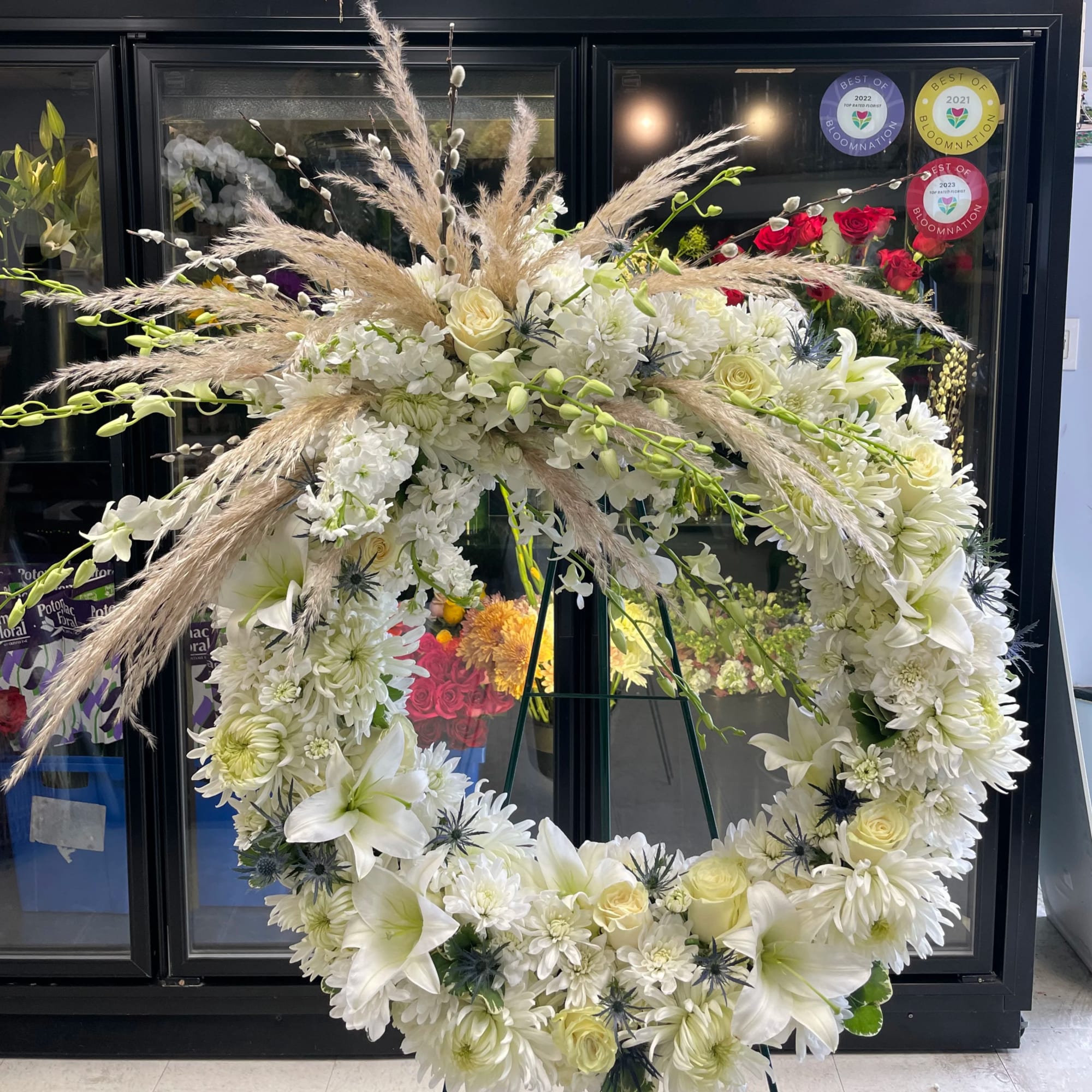 This large classic wreath is delivered on an easel, and is a This large classic wreath is delivered on an easel, and is a