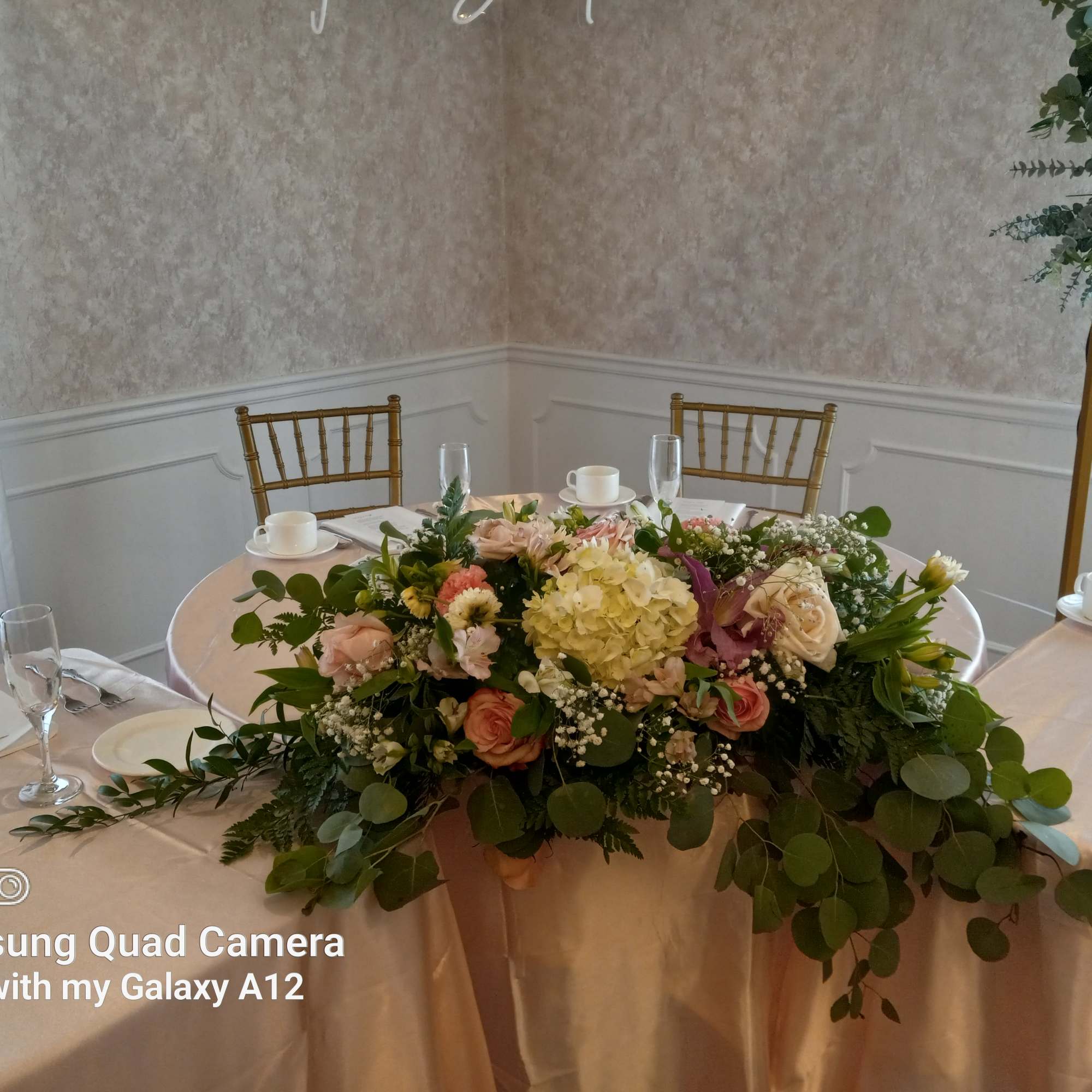 Beautiful pink and white flowers sweetheart table accent  centerpiece 