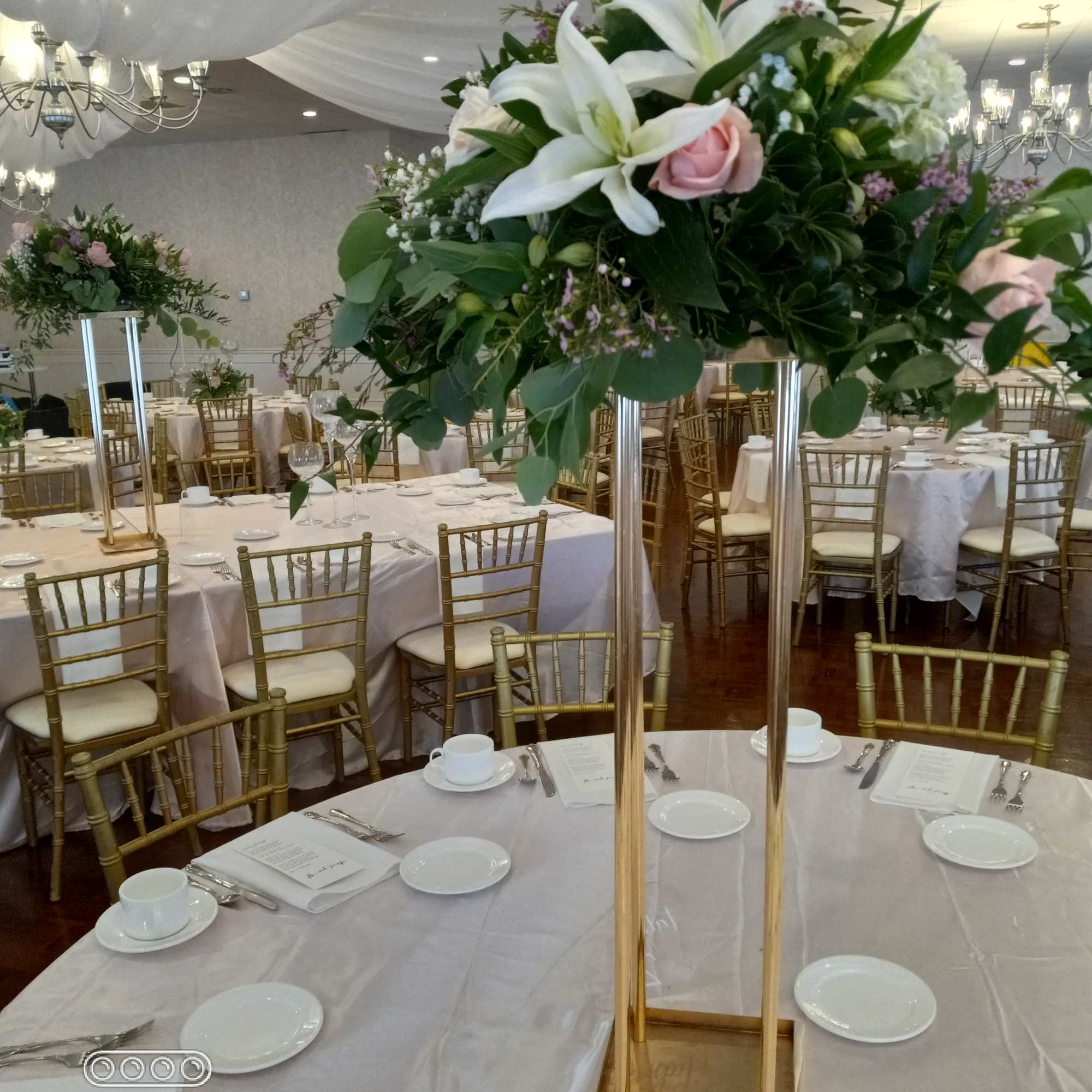 Nice and festive white lilies and pink roses with greenery and baby's
