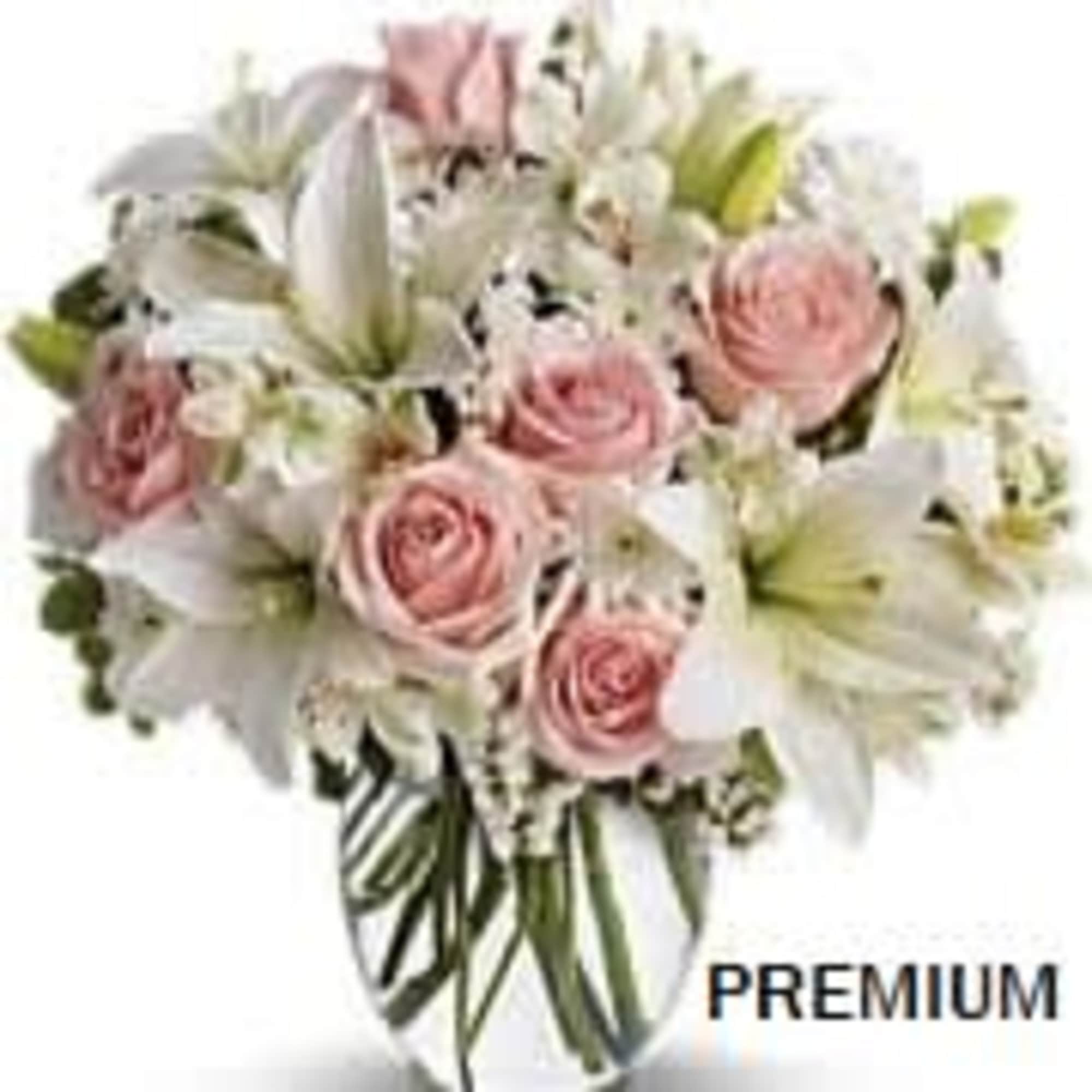 Pink and white color flowers as shown, arranged in a vase. The