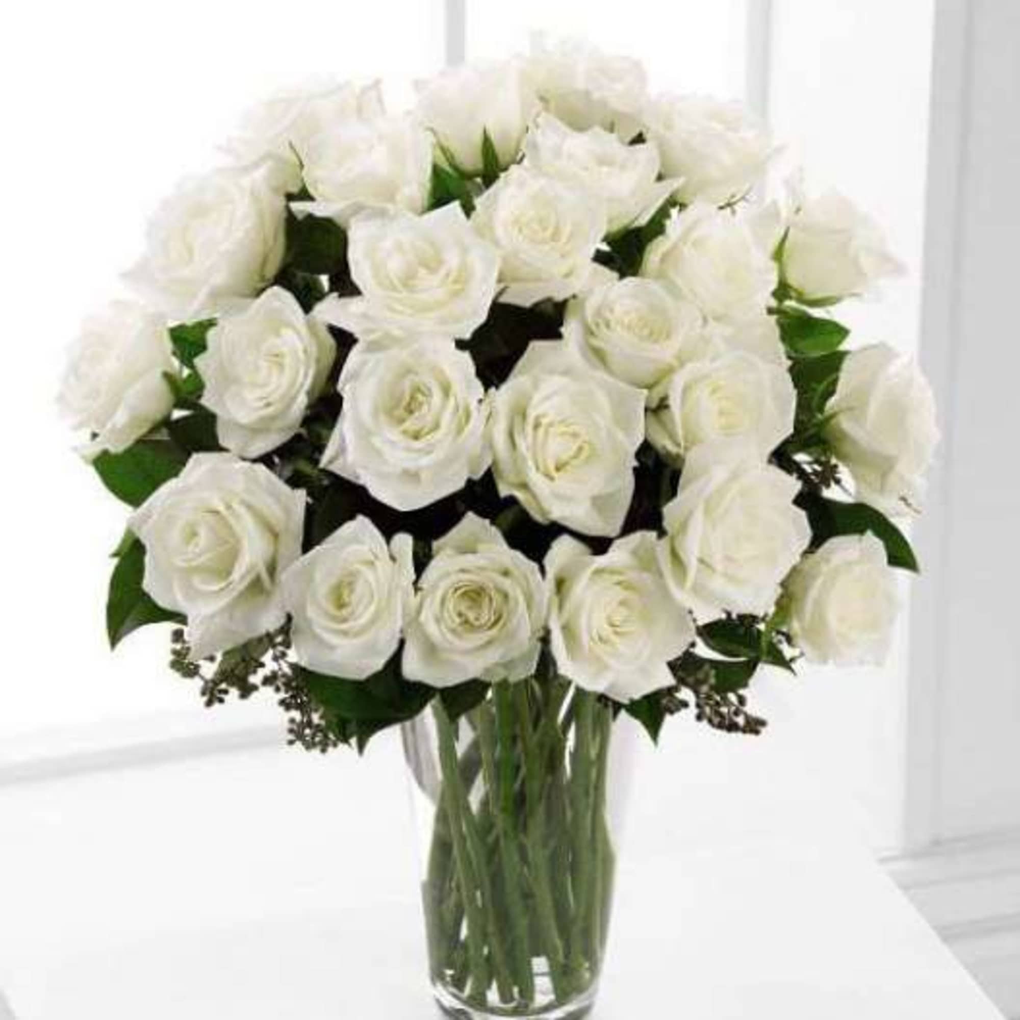 24 White Roses arranged in a vase