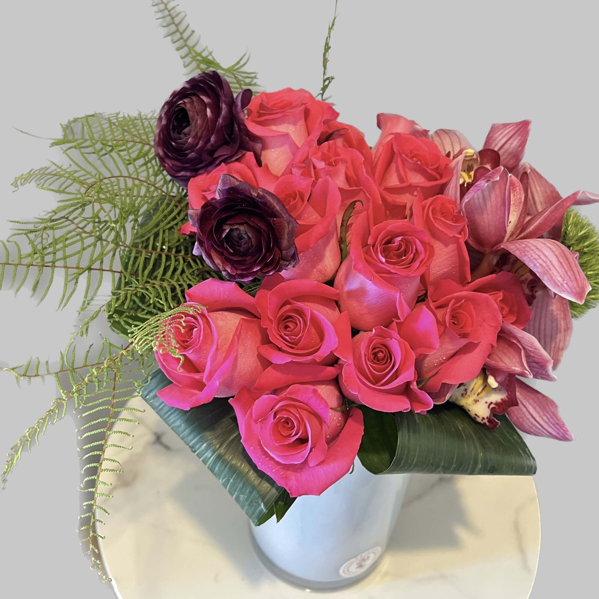 A lovely hot pink roses arrangement featuring , makes a great gift