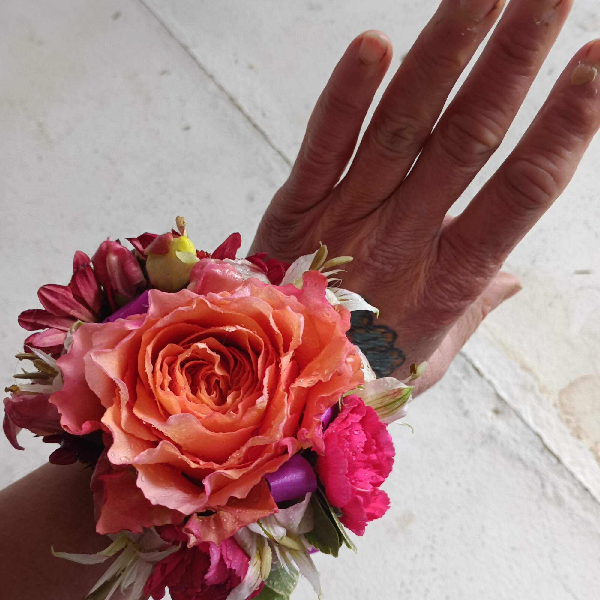 Beautiful variegated orange rose corsage 