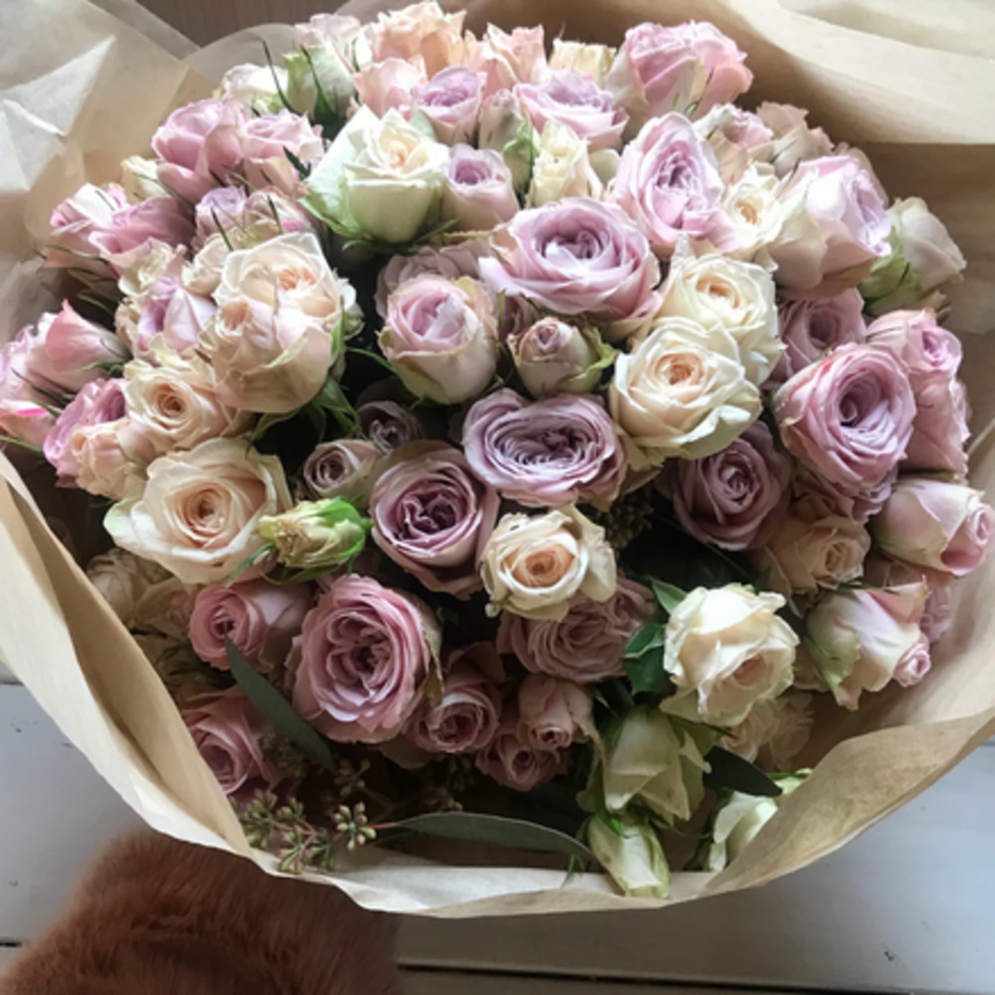 Perfect palette of pastel spray roses in this little romantic hand tied