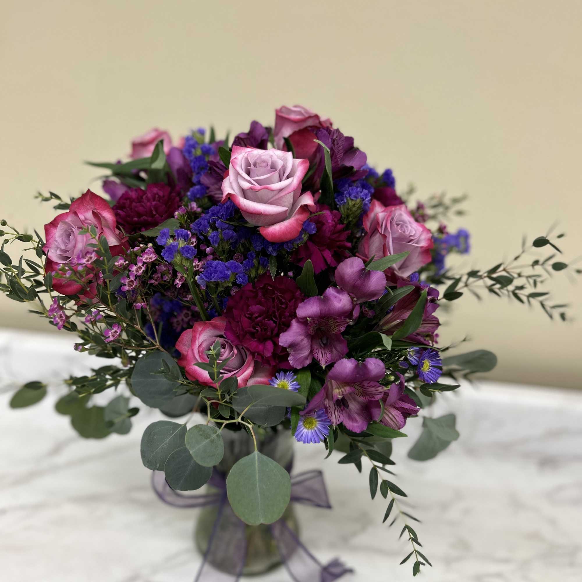 All mixed shades of purples in a vase