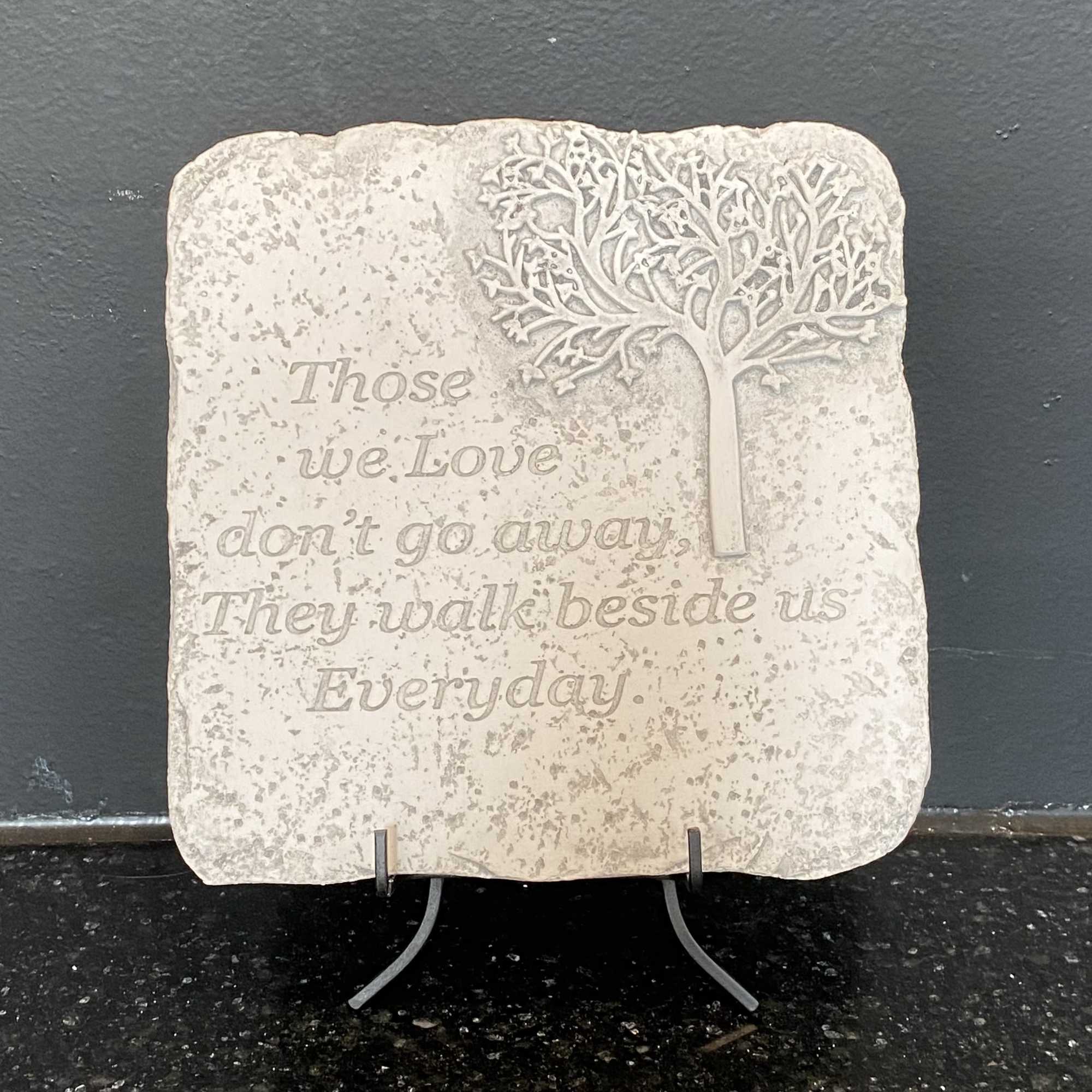 Stone reads, "Those we Love don't go away, They walk beside us Stone reads, "Those we Love don't go away, They walk beside us