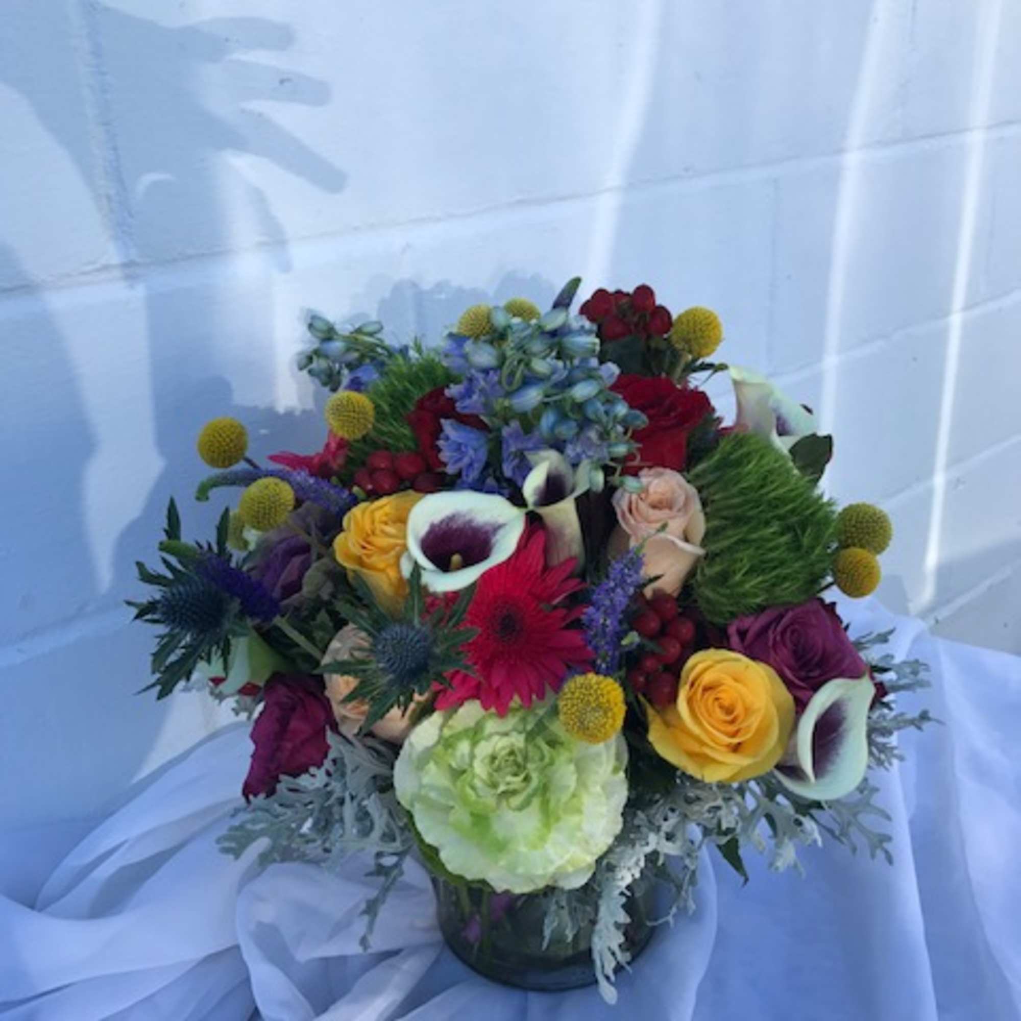 cylinder vase of beautiful mixed flowers