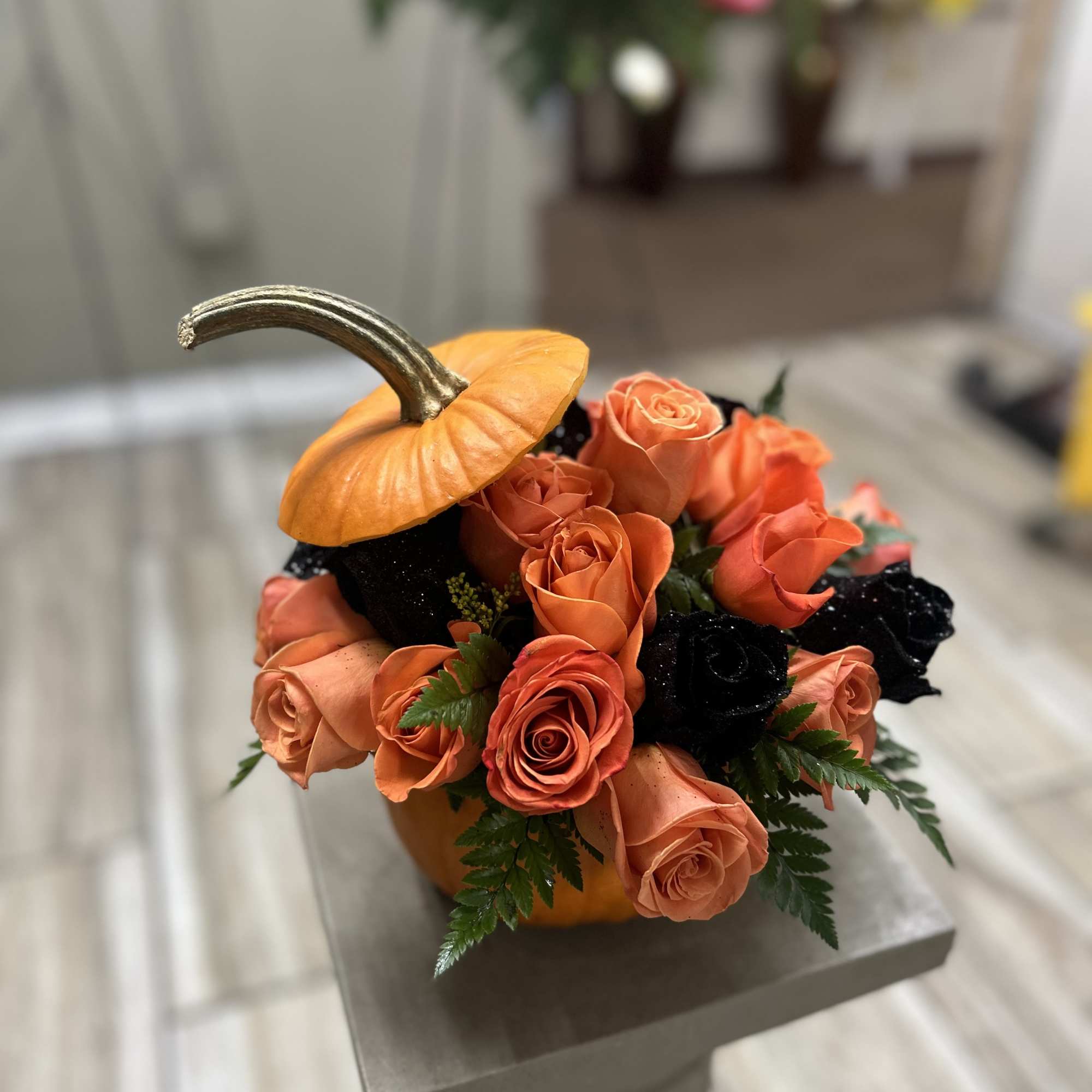 Pumpkin arrangements comes with roses and a card message 