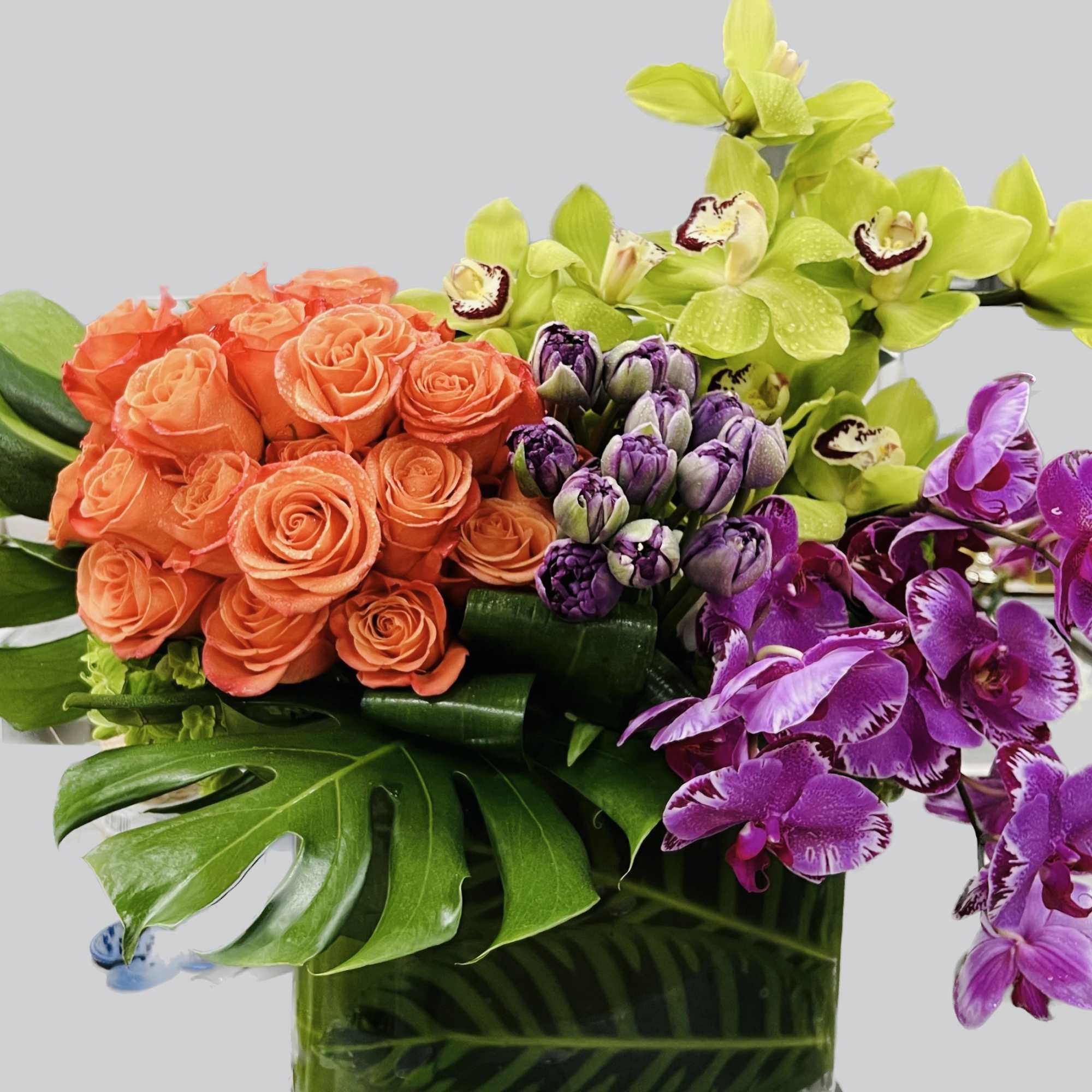 A celebration of life, this large and jewel toned arrangement is enough