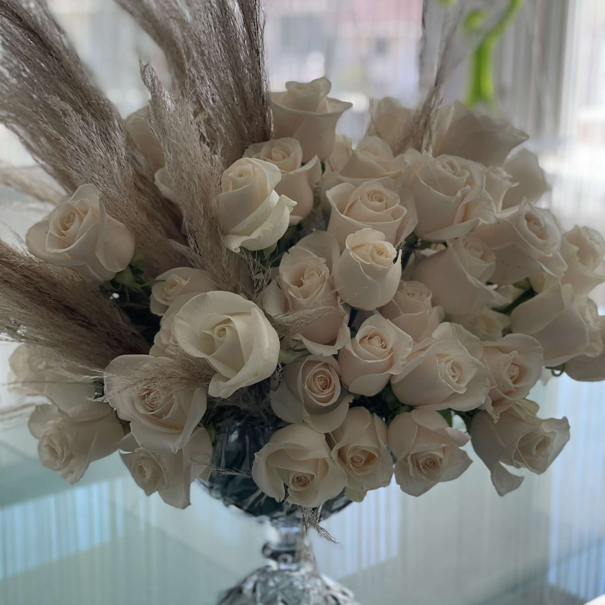 This incredible arrangement offers a modern design with a full, lush finish.