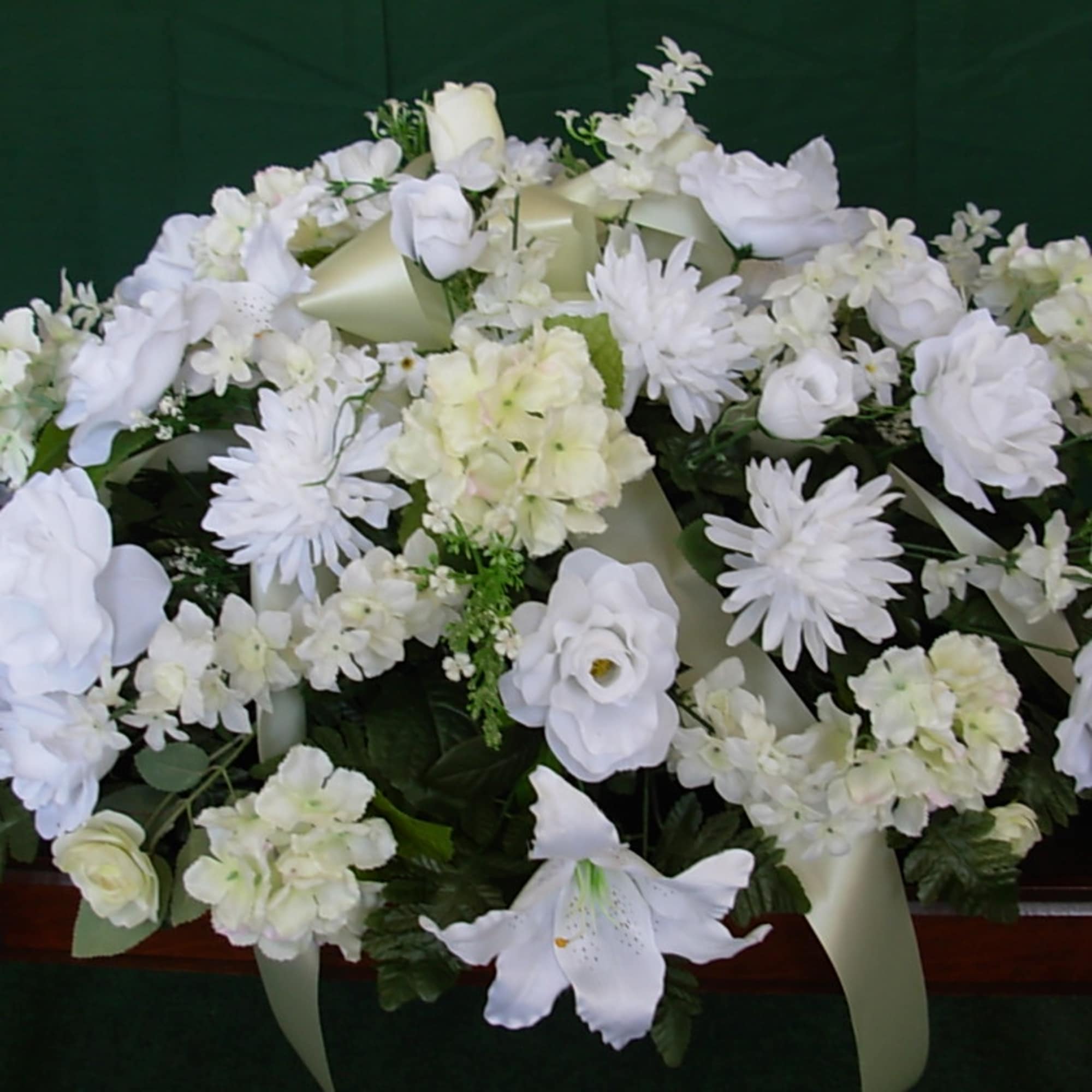 OUR TRADITIONAL ALL WHITE SILK CASKET SPRAY is made of all white