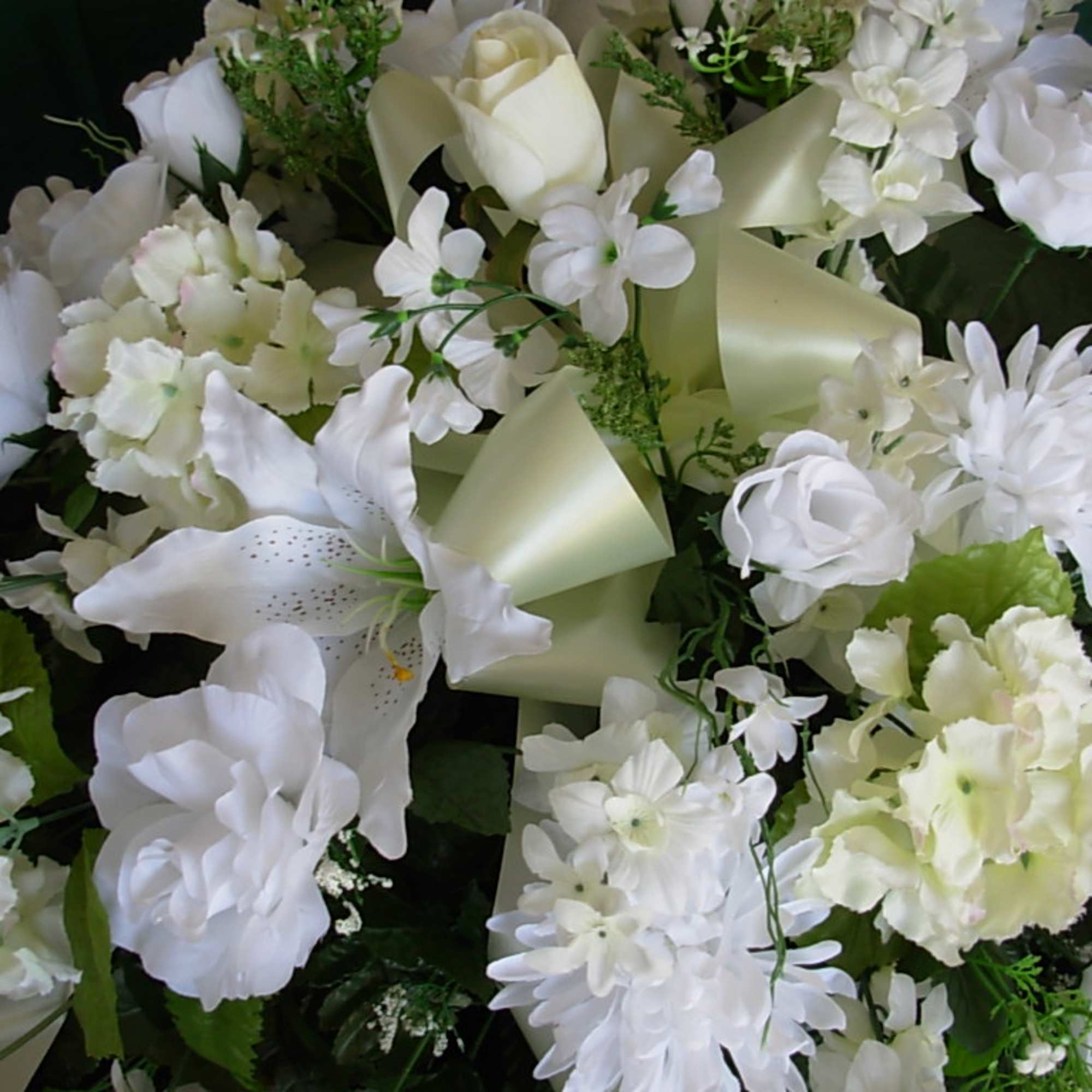 OUR TRADITIONAL ALL WHITE SILK CASKET SPRAY is made of all white