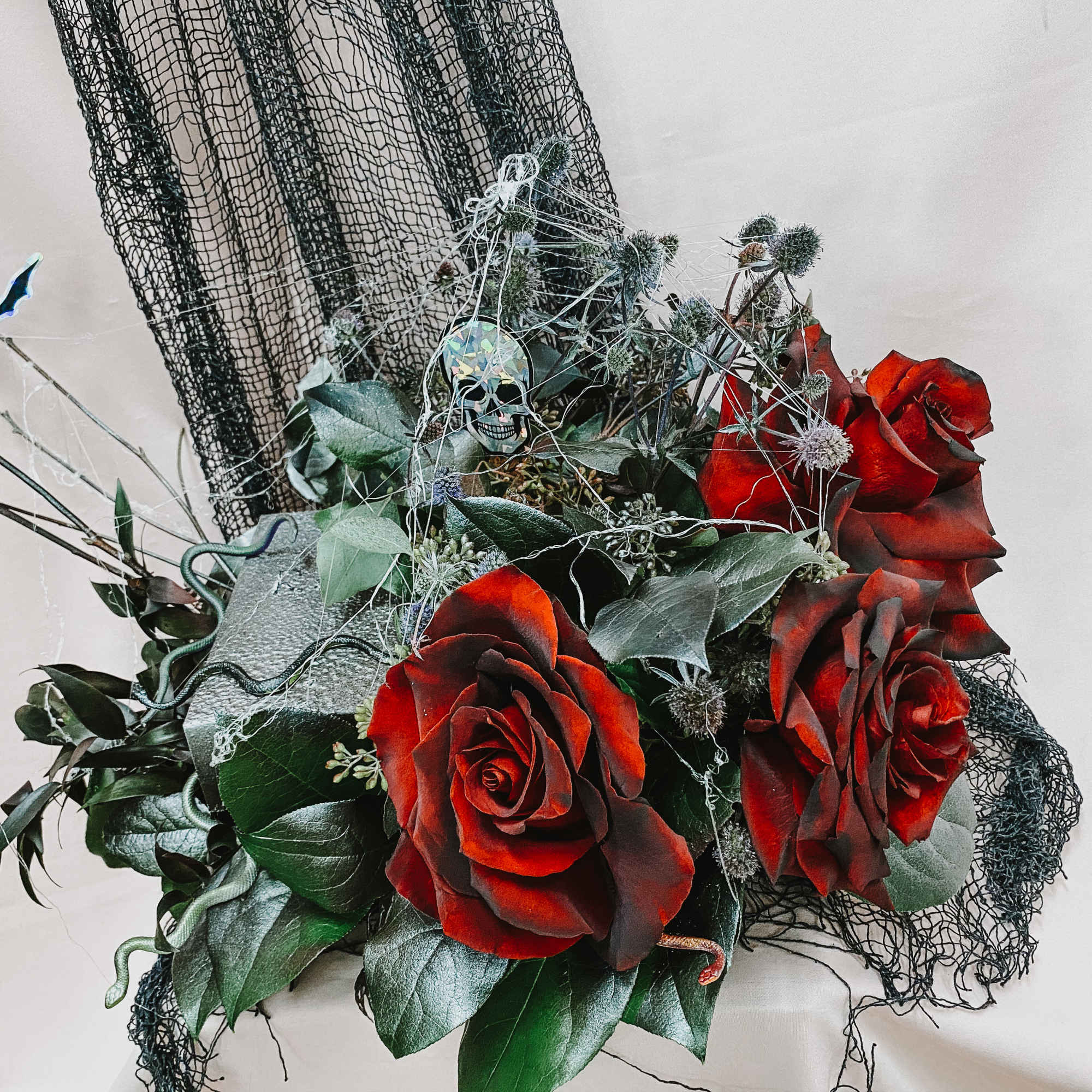 Custom designed black roses or sprayed red roses specially for the perfect