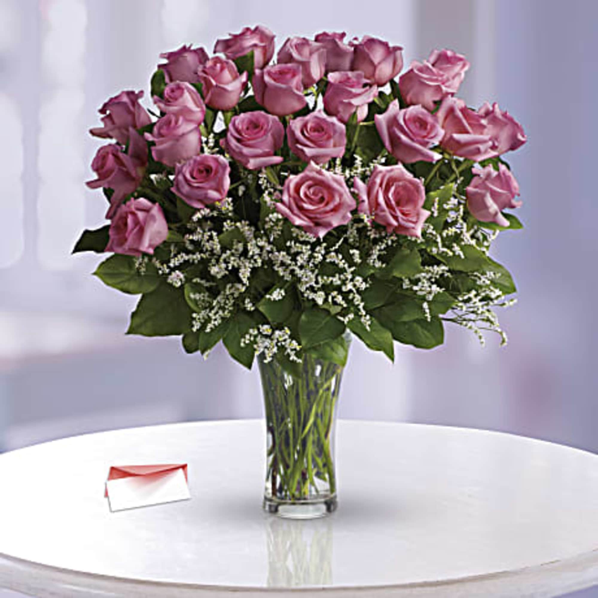 Blushing pink roses and delicate white limonium add up to a feminine