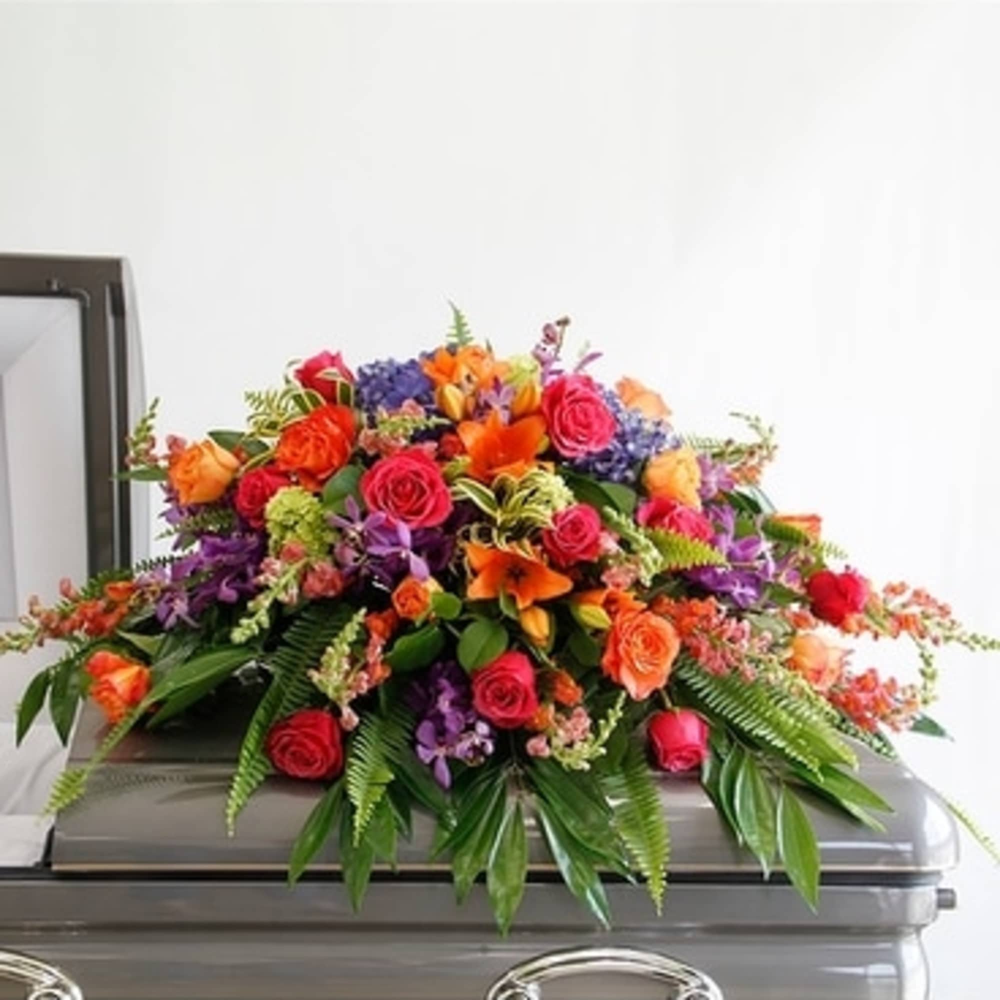This incredible casket spray from the Bright Remembrance Collection is stunning with