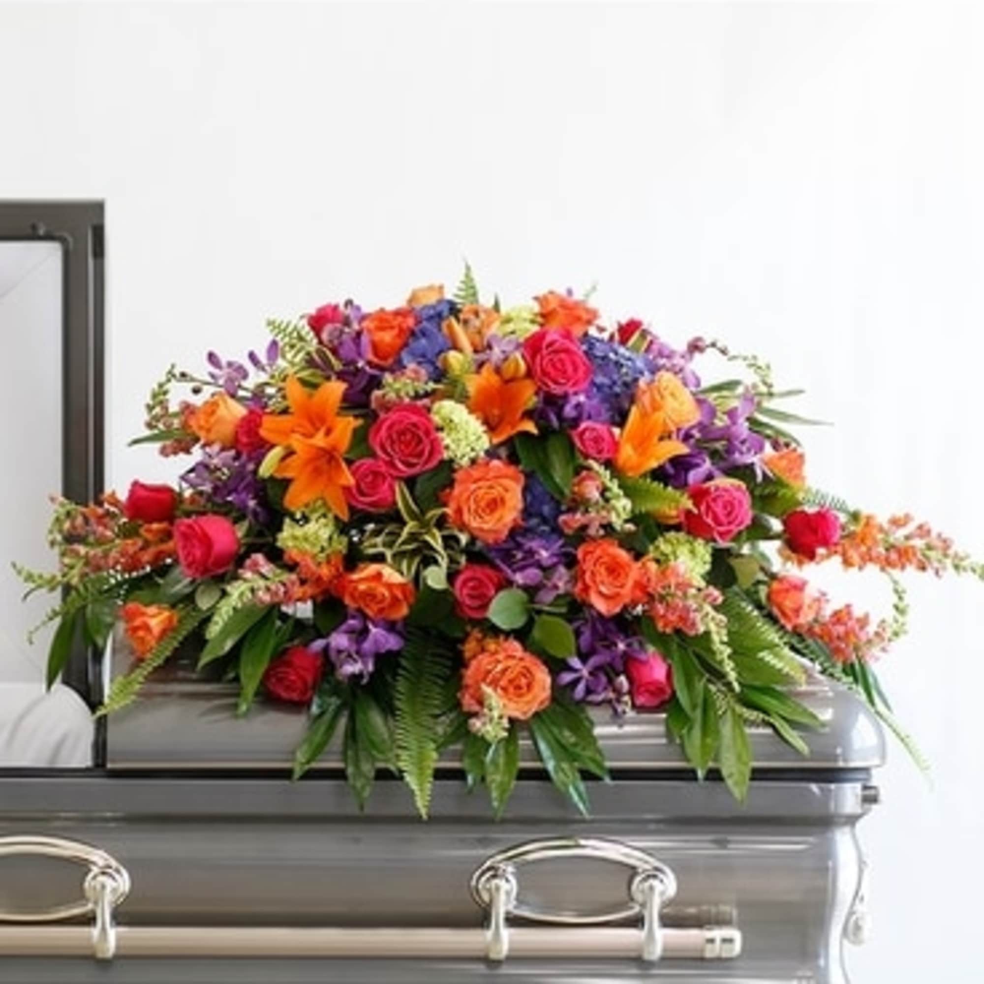 This incredible casket spray from the Bright Remembrance Collection is stunning with