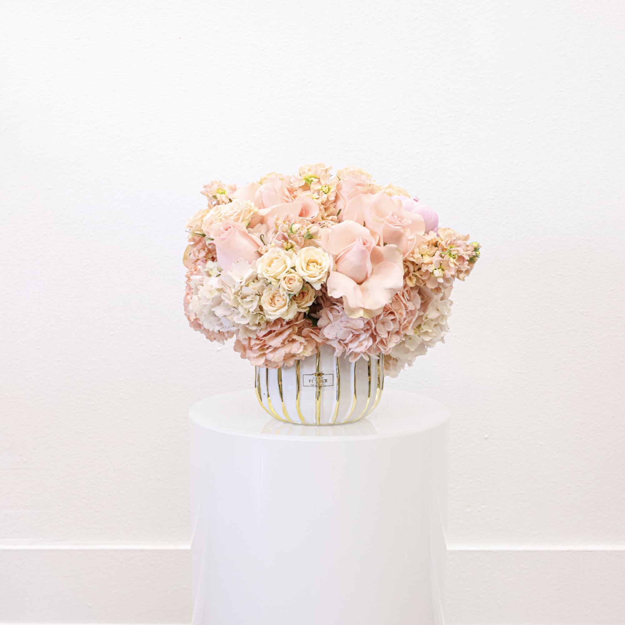 Bring beauty to the table with elegant arrangement, presented in a round