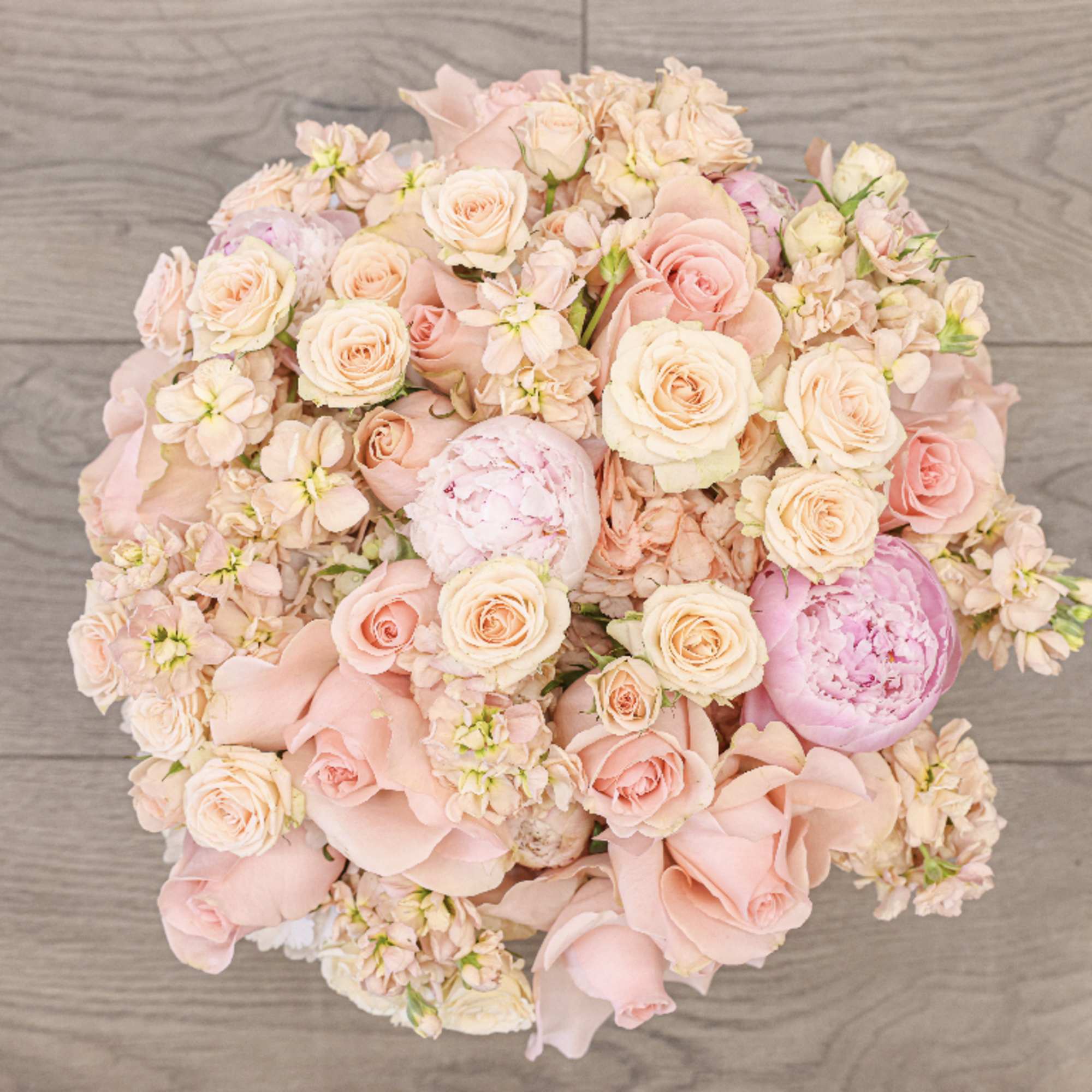 Bring beauty to the table with elegant arrangement, presented in a round