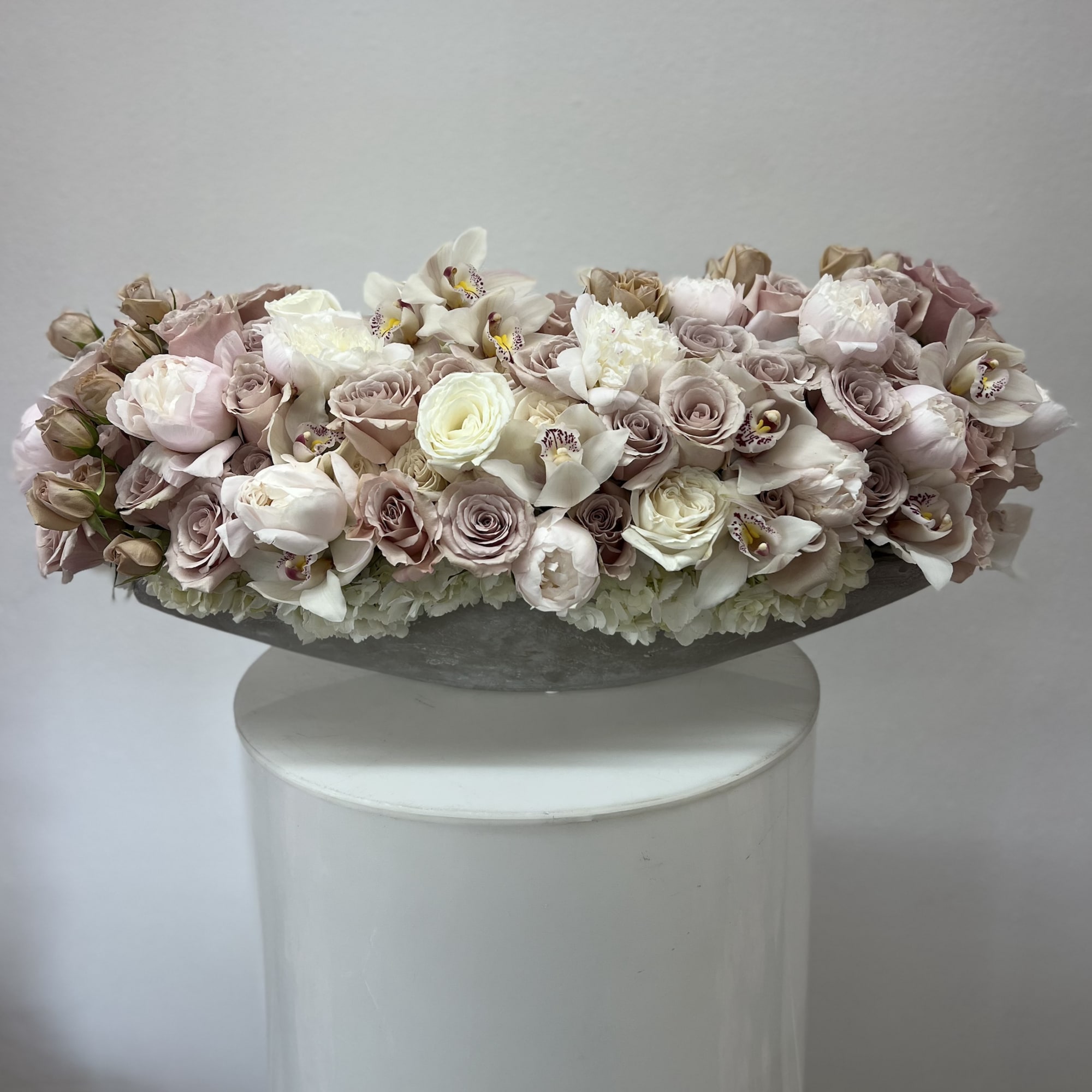 Bring beauty to the table with elegant arrangement, presented in a long