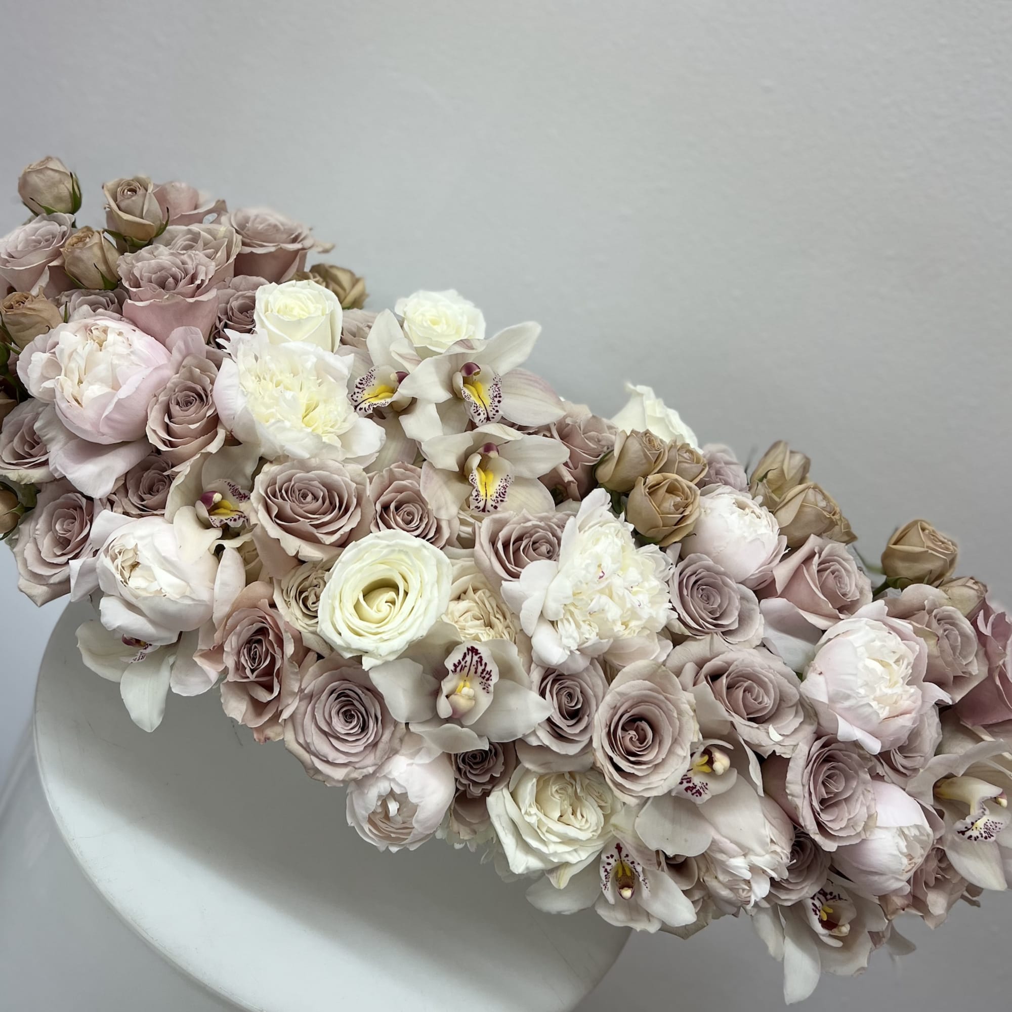 Bring beauty to the table with elegant arrangement, presented in a long