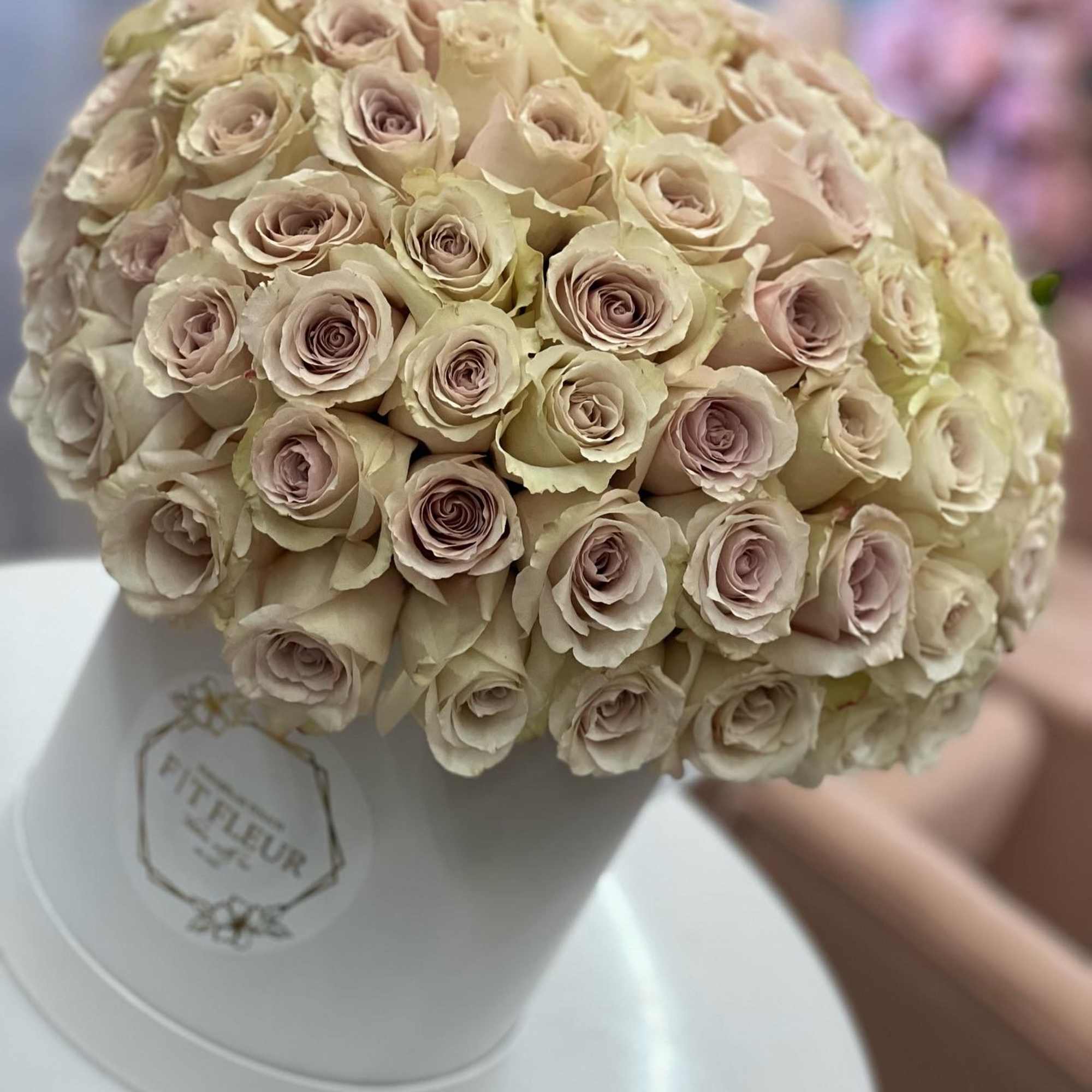 Bring beauty to the table with elegant arrangement, presented in a hat