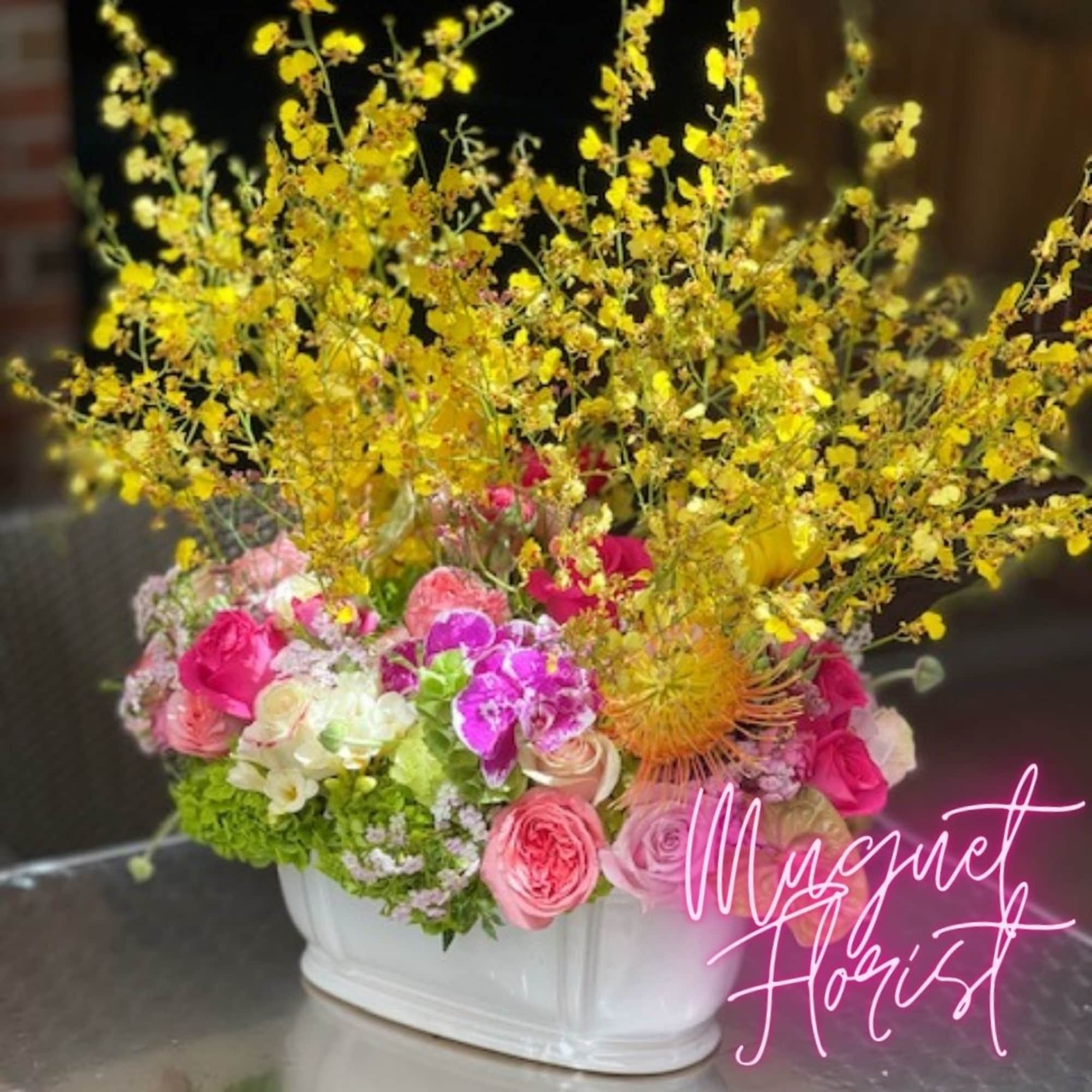 Indulge in the enchanting beauty of &quot;Elegant Oncidium Orchid Dreams,&quot; an arrangement