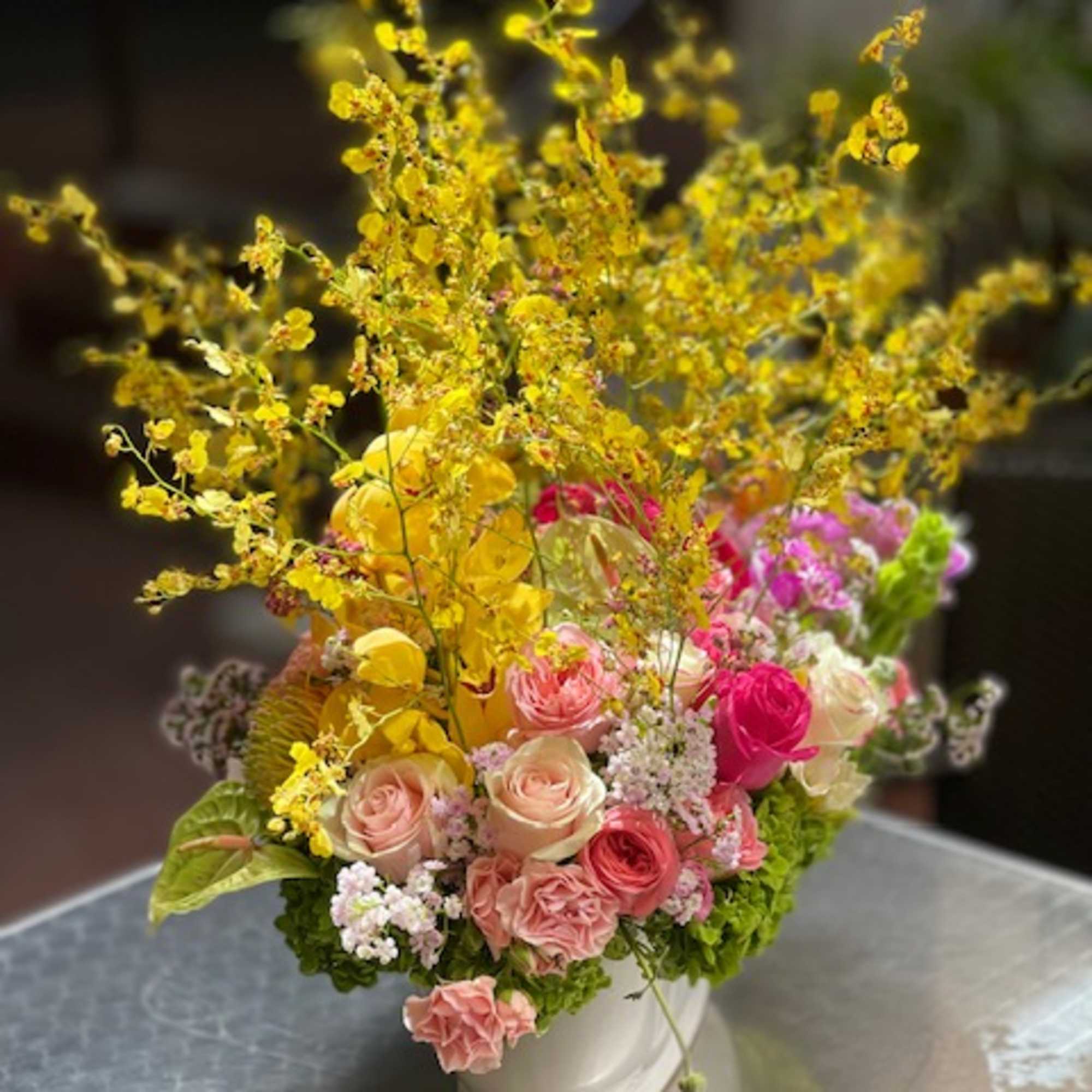 Indulge in the enchanting beauty of &quot;Elegant Oncidium Orchid Dreams,&quot; an arrangement
