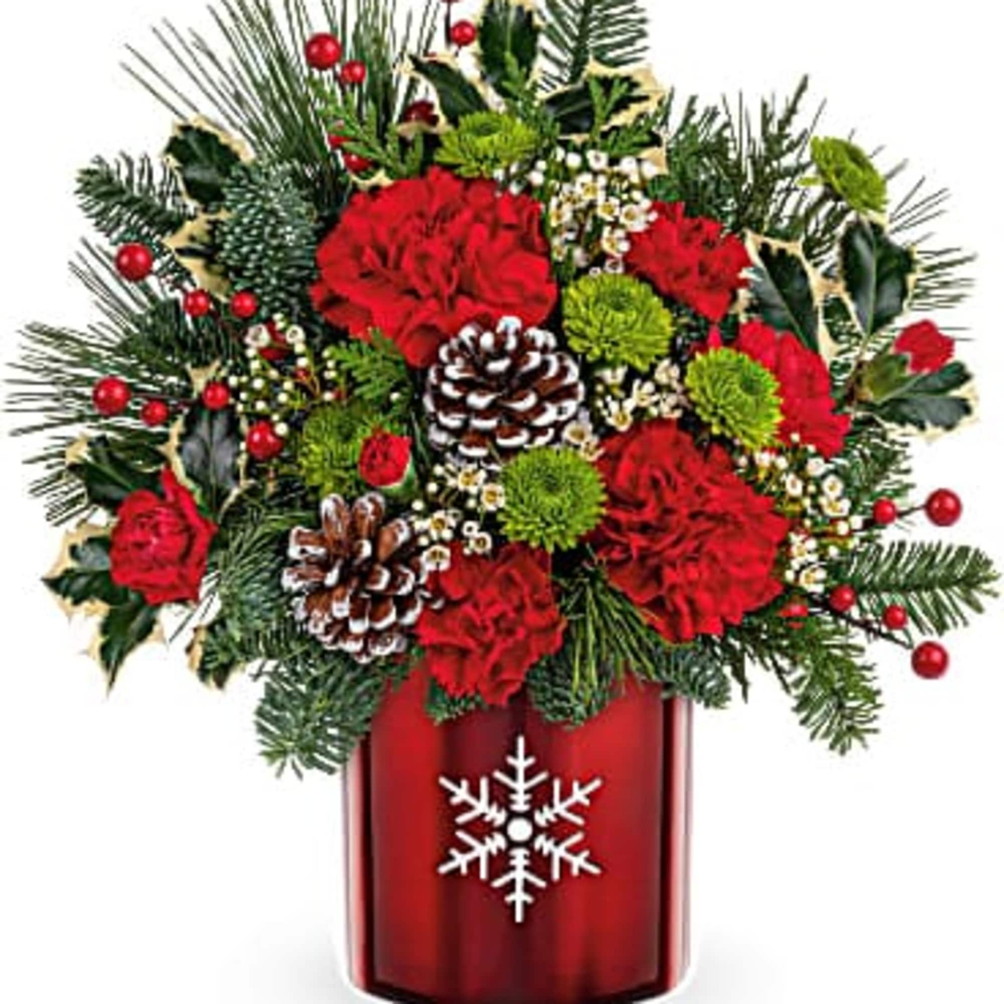 Perfect presentation for classic Christmas blooms designed in a metal vase with