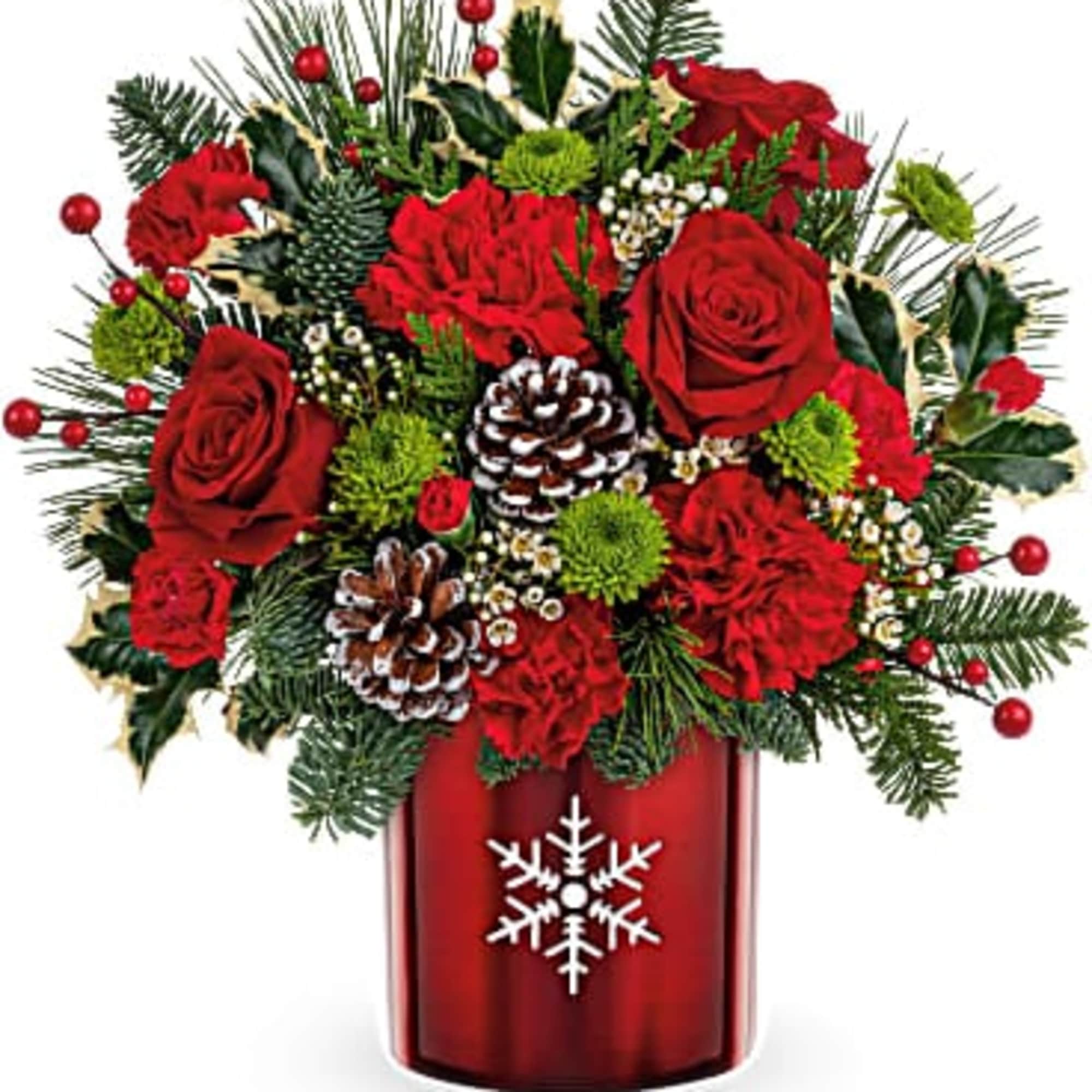 Perfect presentation for classic Christmas blooms designed in a metal vase with