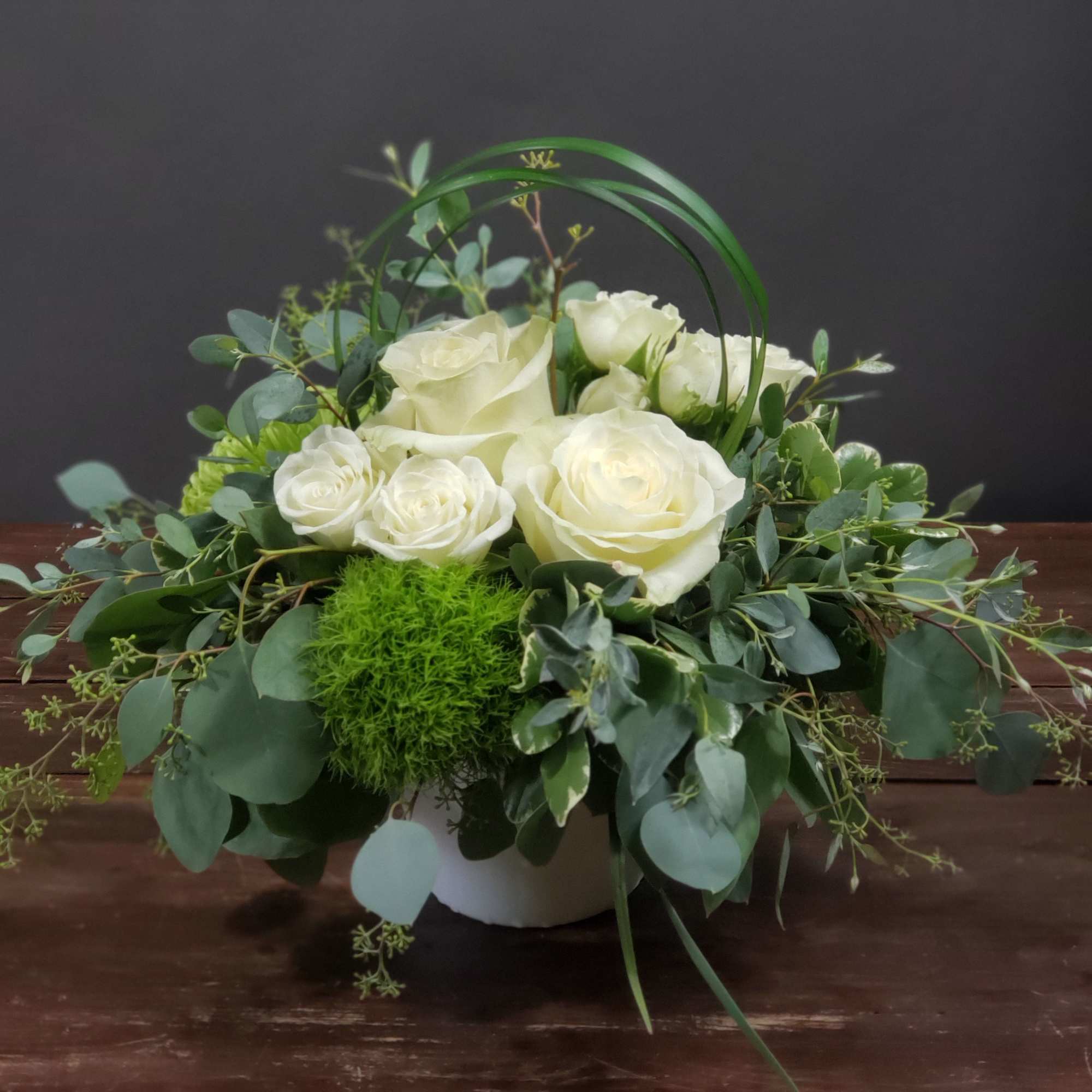 These white roses with added greens are great to help calm the