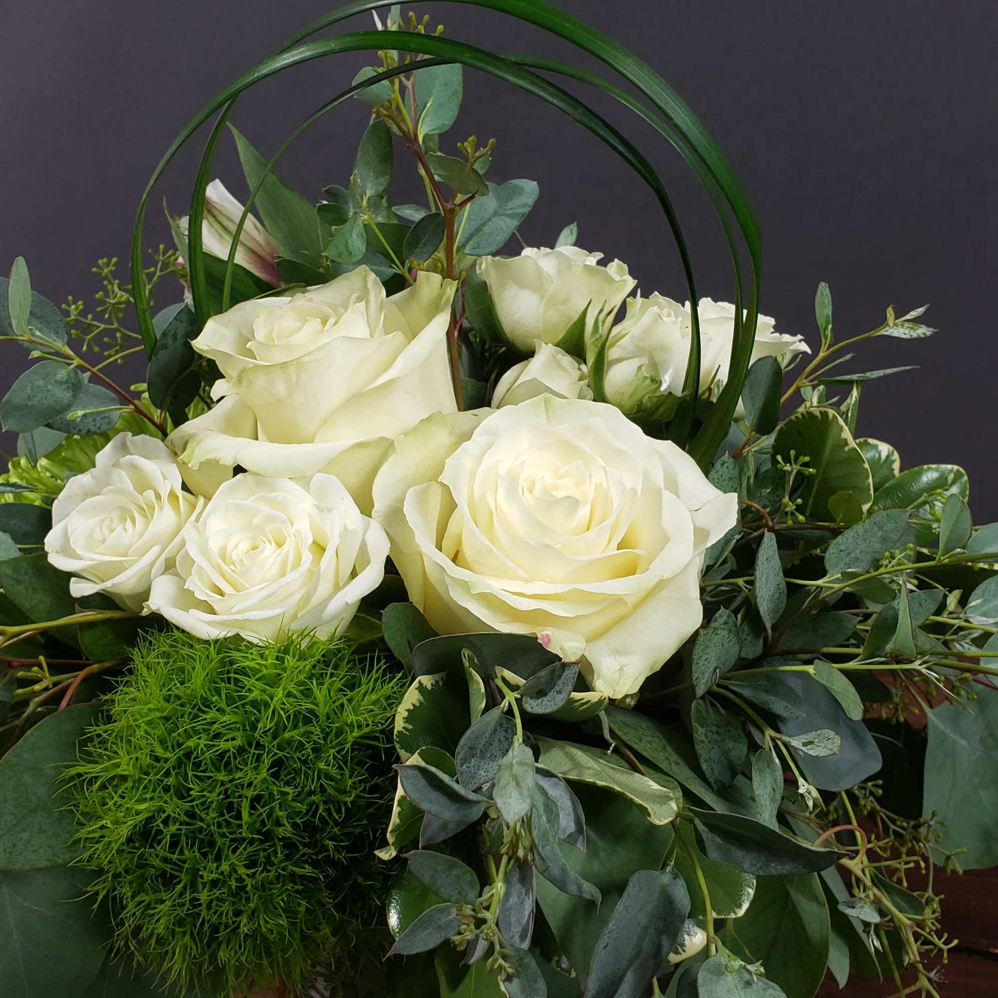 These white roses with added greens are great to help calm the