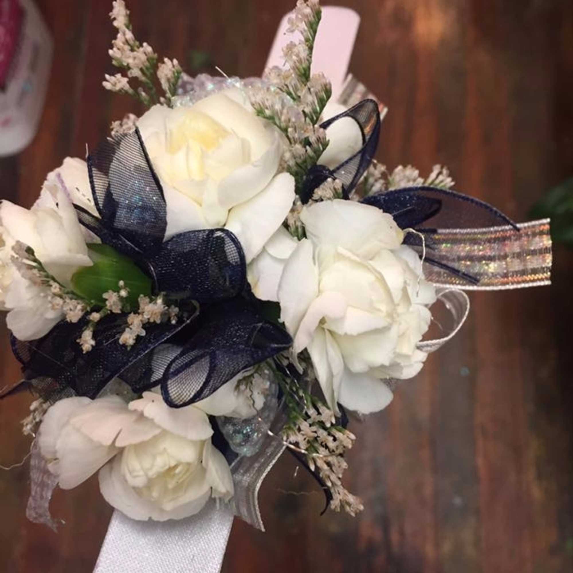 Elegant White Carnation Wrist Corsage in Centerville, IA Elegant White Carnation Wrist Corsage in Centerville, IA