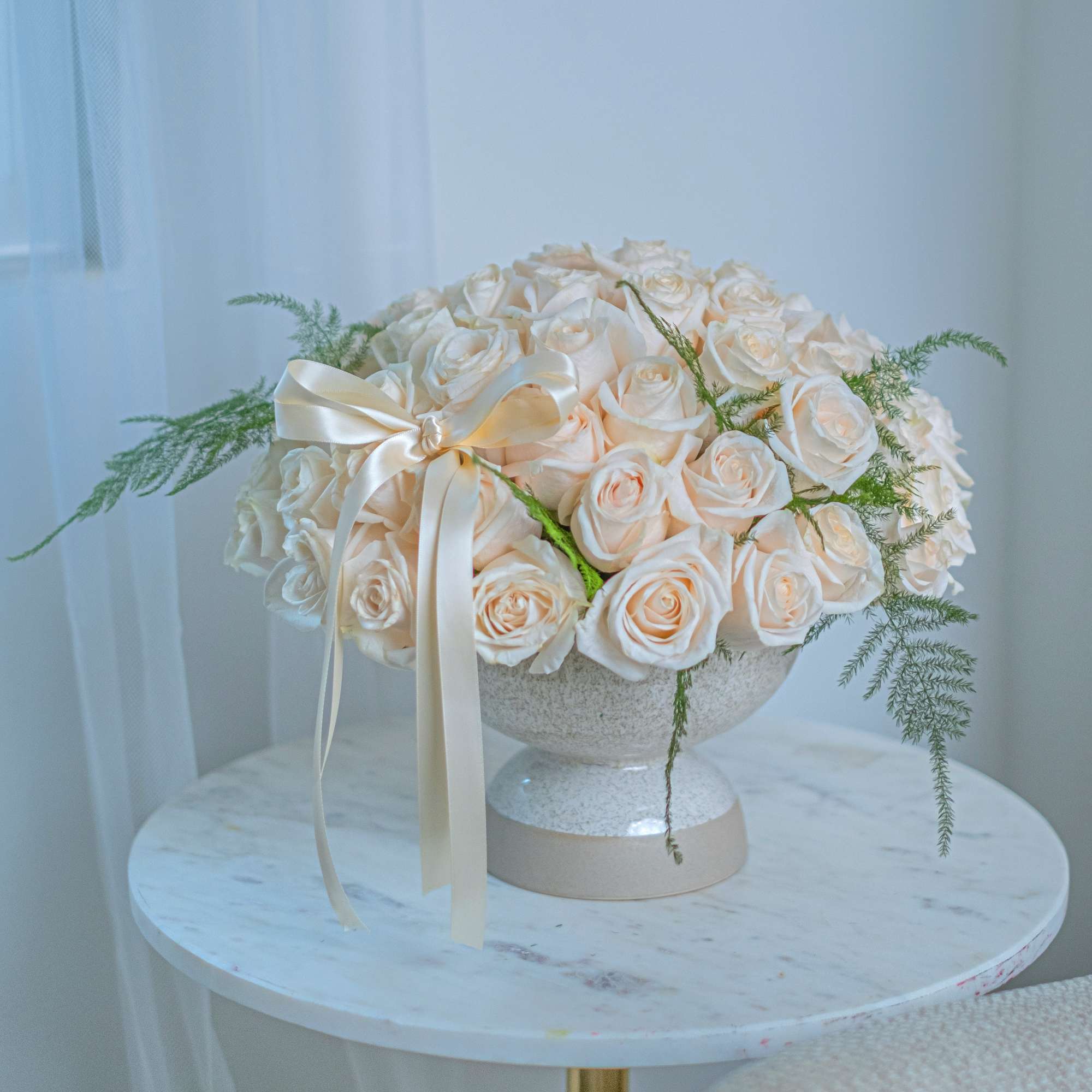 White roses is a win-win option as all women love white roses.