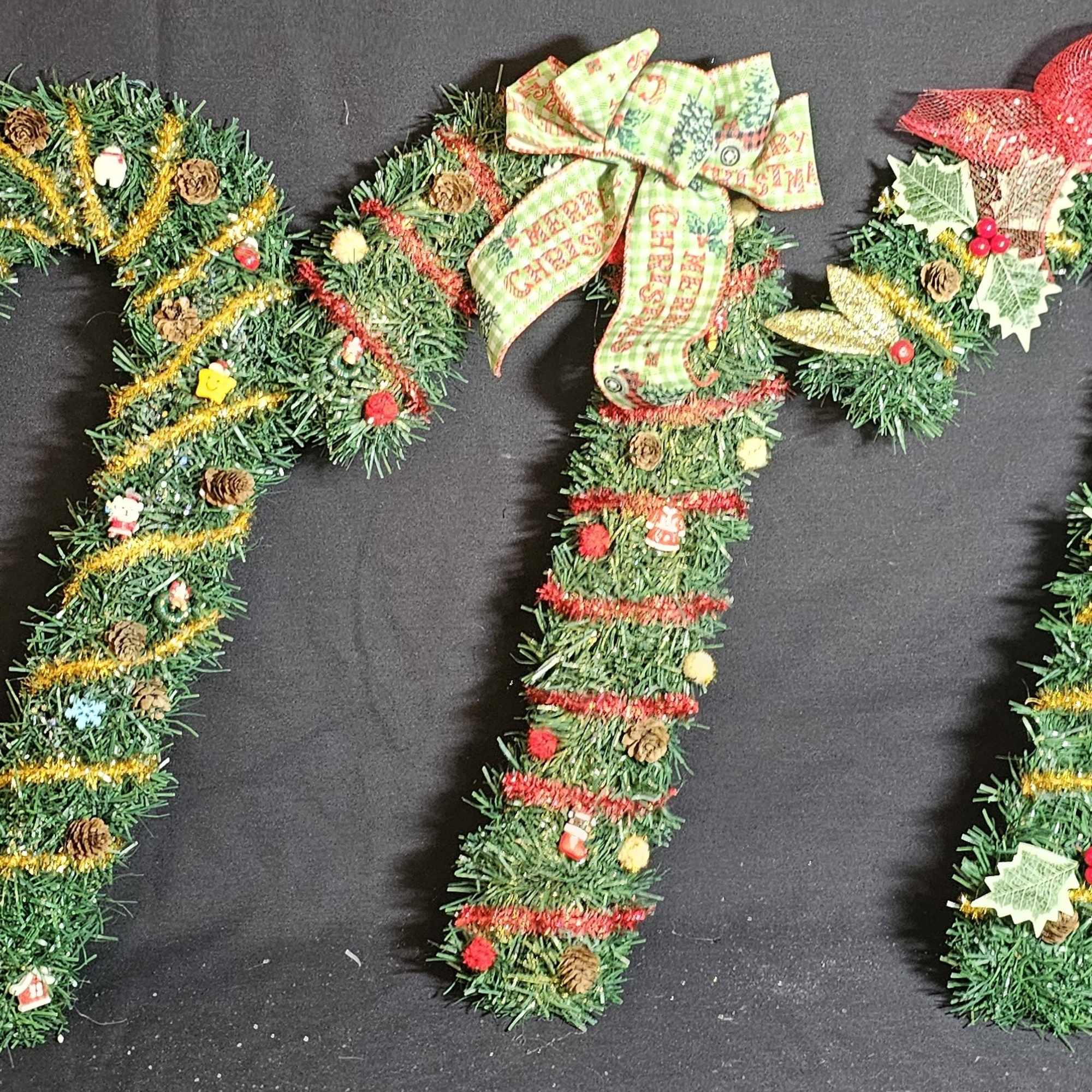 Assorted candy cane wreathes.  Pick one each for your Christmas celebration