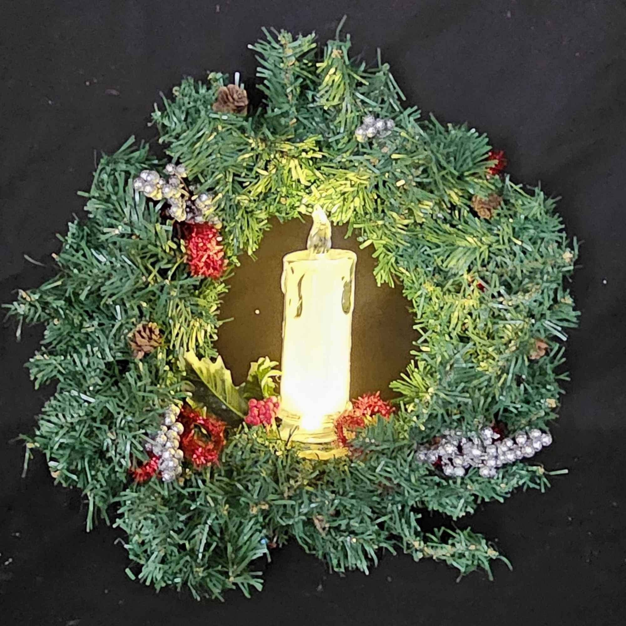 Christmas lightup night wreathes with artificial candles to highlight the holiday season.