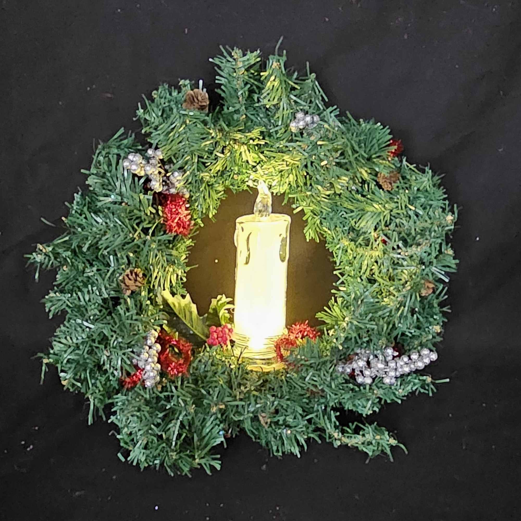 Christmas lightup night wreathes with artificial candles to highlight the holiday season.