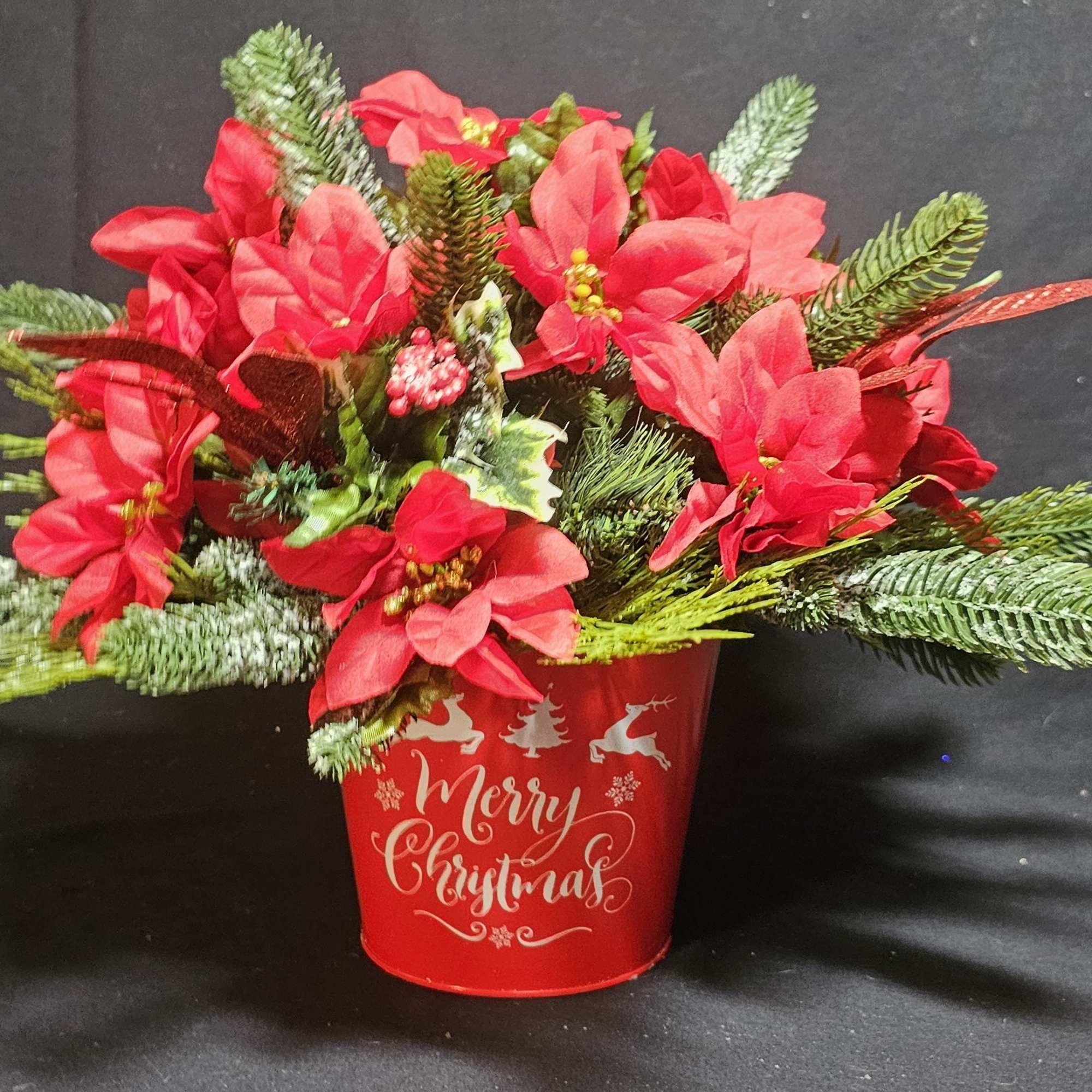 Classic artificial poinsettia in bucket pot