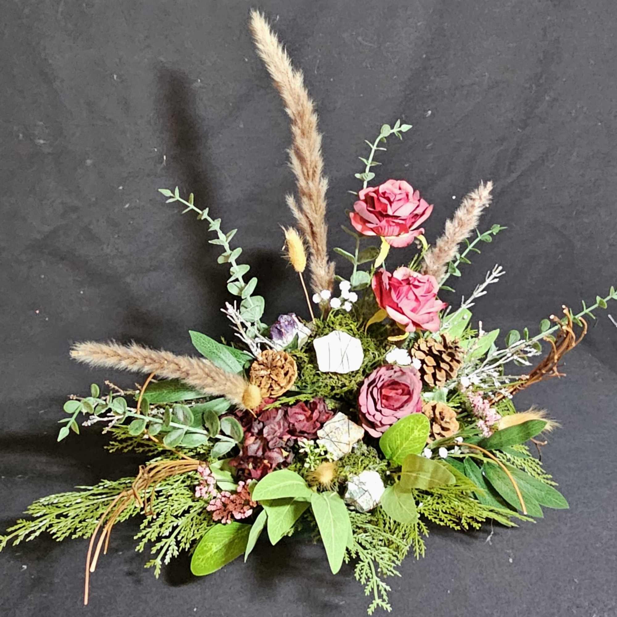 Traditional center piece made of fall flowers and greens