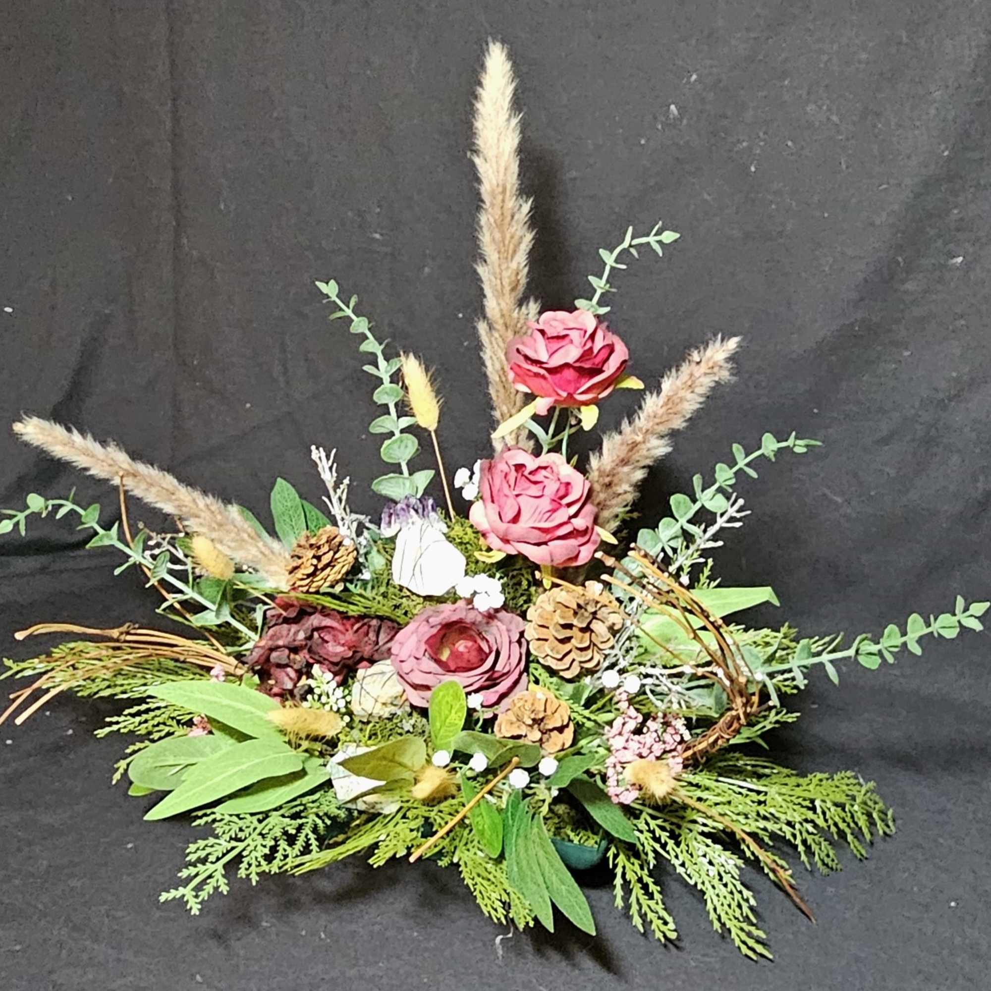 Traditional center piece made of fall flowers and greens