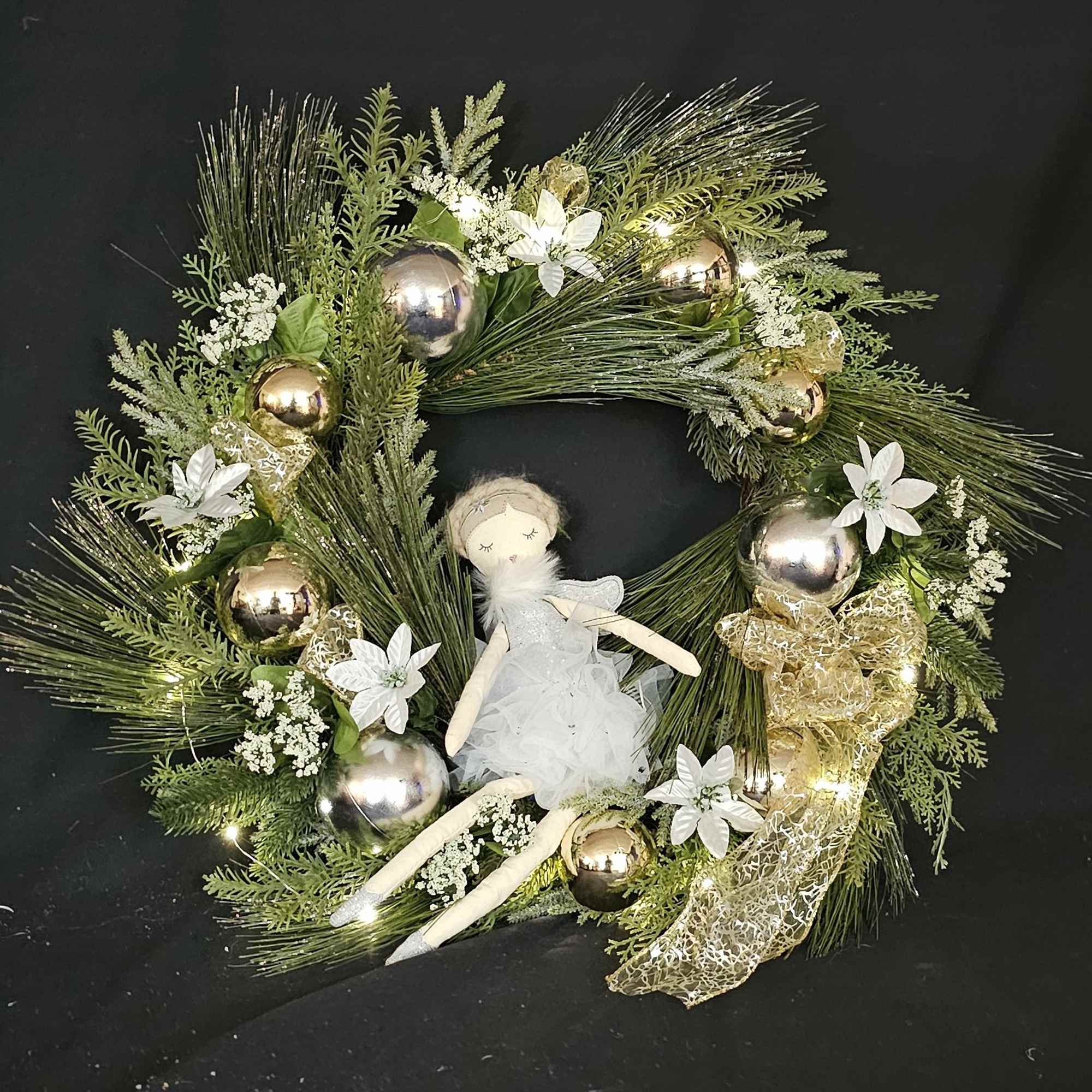 Seasonal wreath with dancing fairly with silver highlights