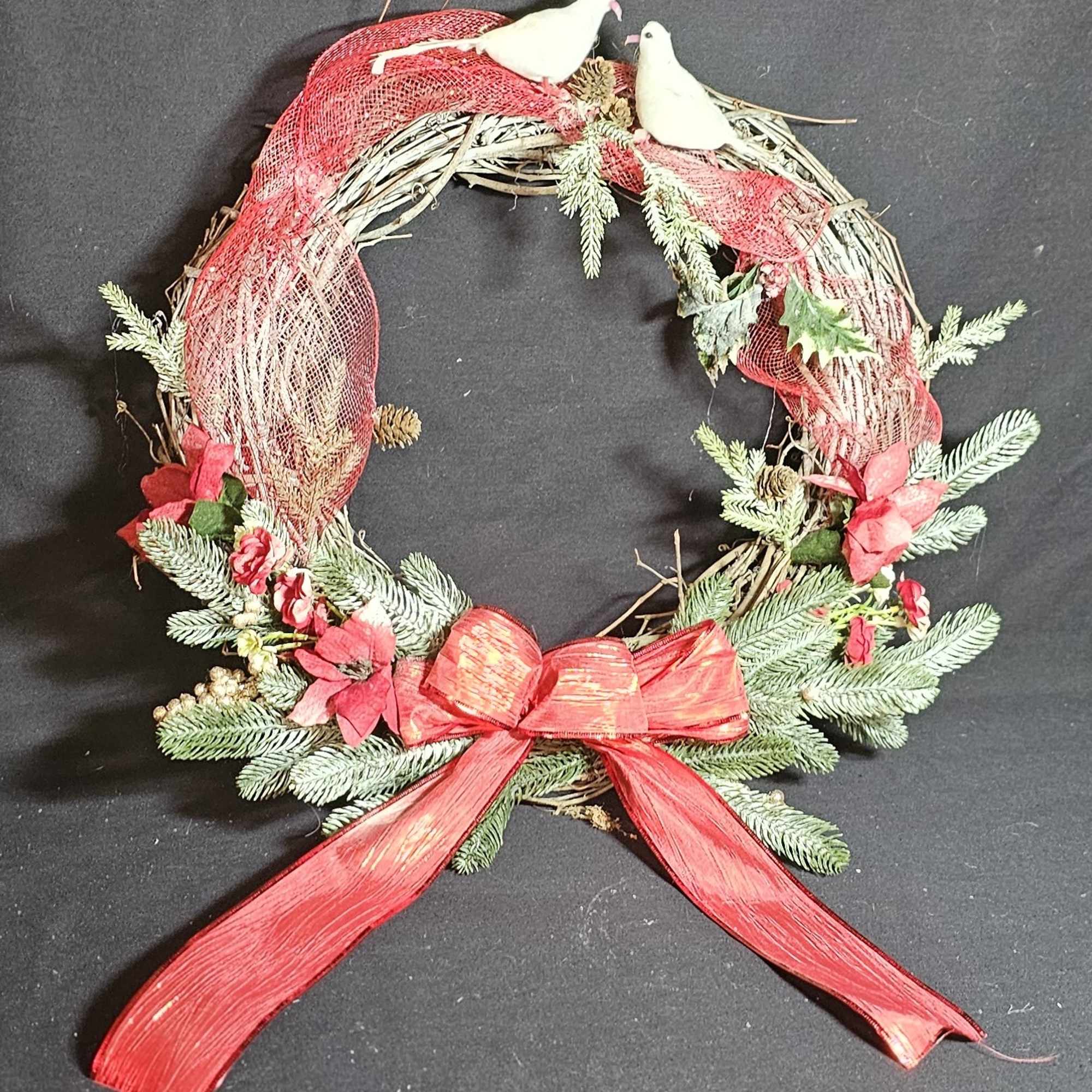 Classic Christmas wreath with doves and a red bow