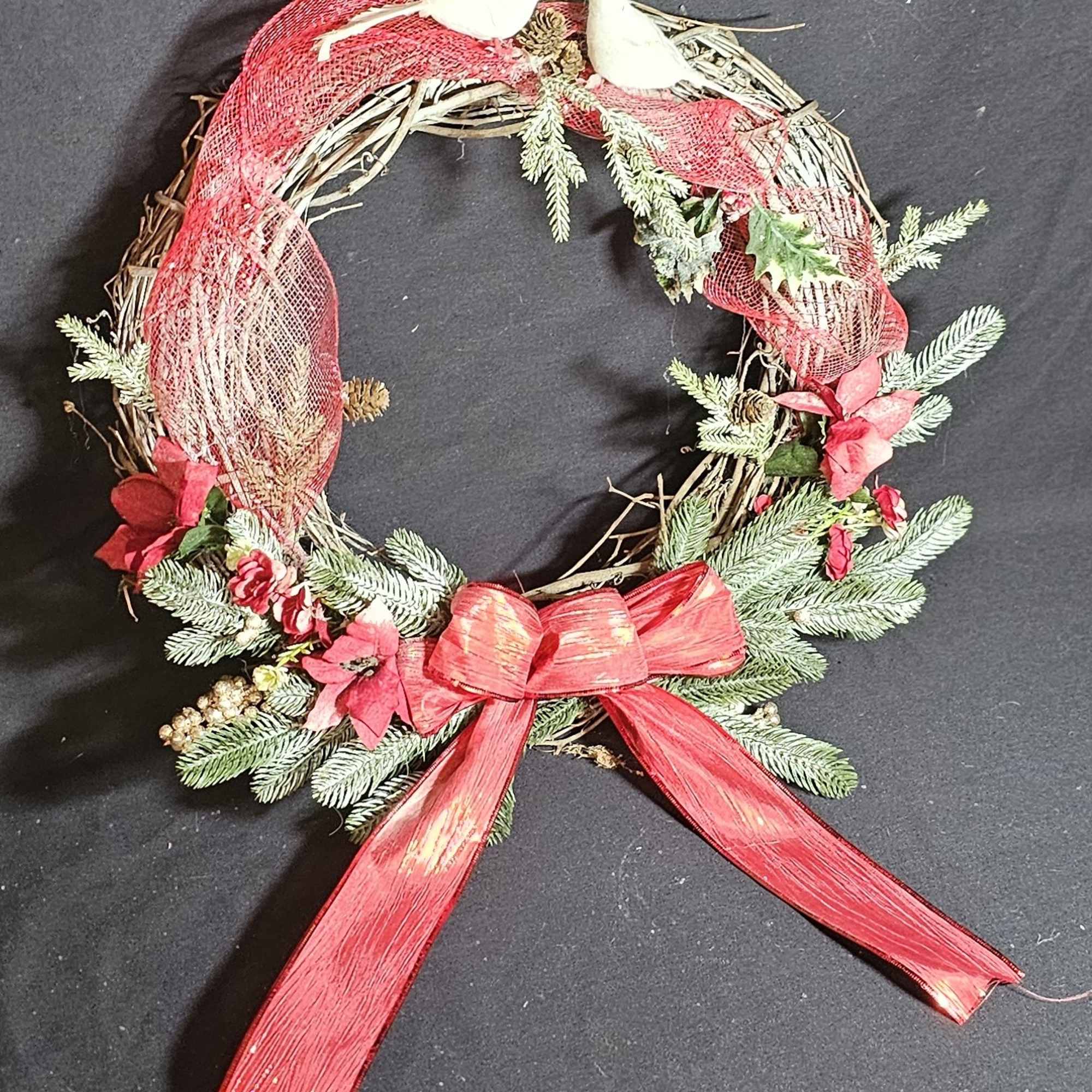 Classic Christmas wreath with doves and a red bow