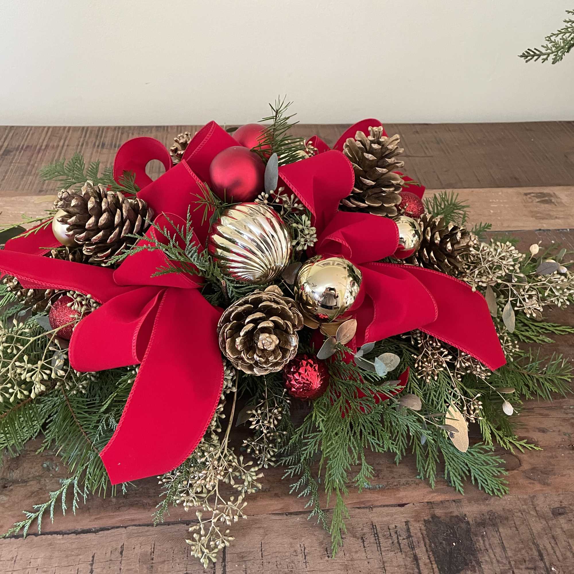 Red and gold ornaments with ribbon and bows
