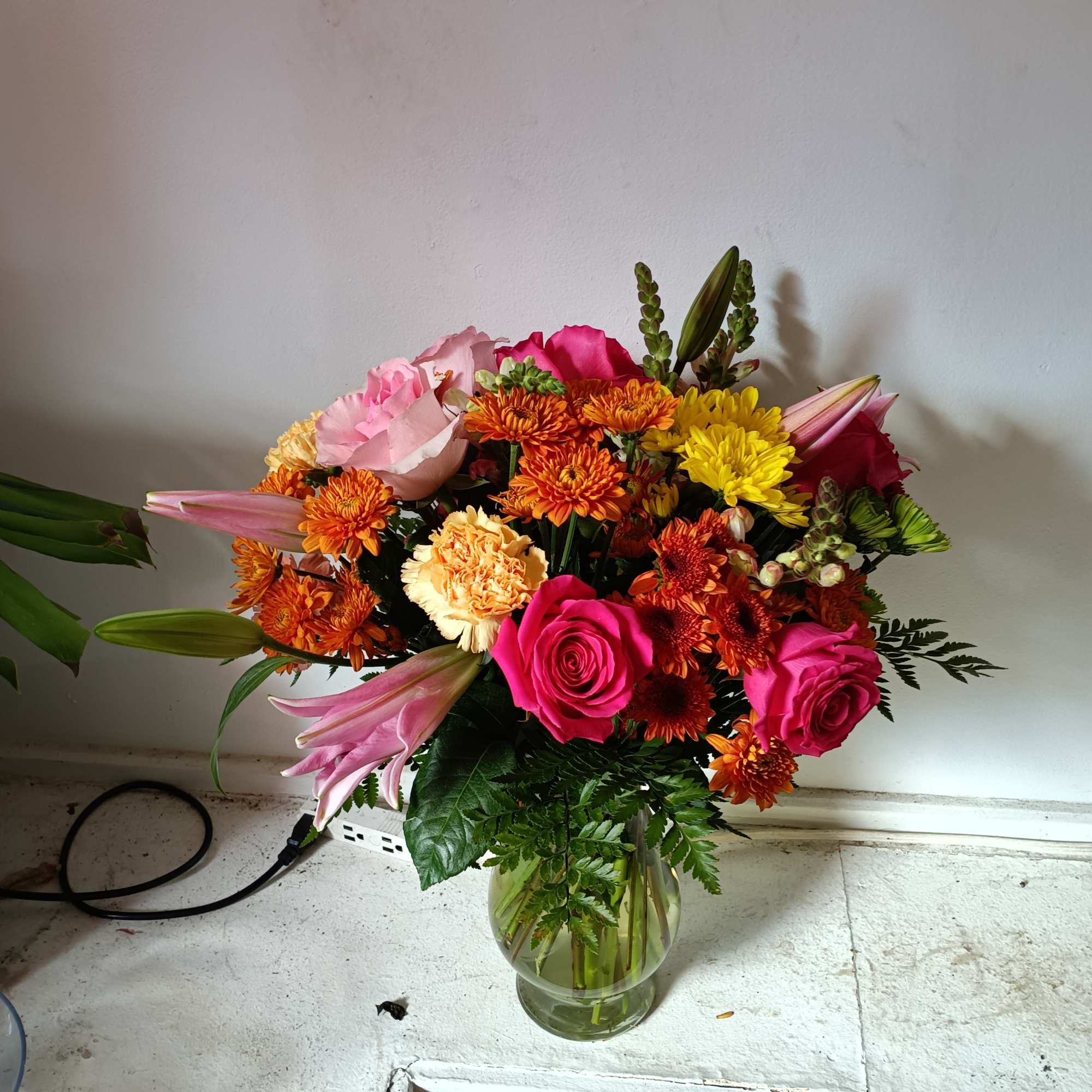 Beautiful hot pink "Pink Floyd" roses bland in with copper daisies, pale