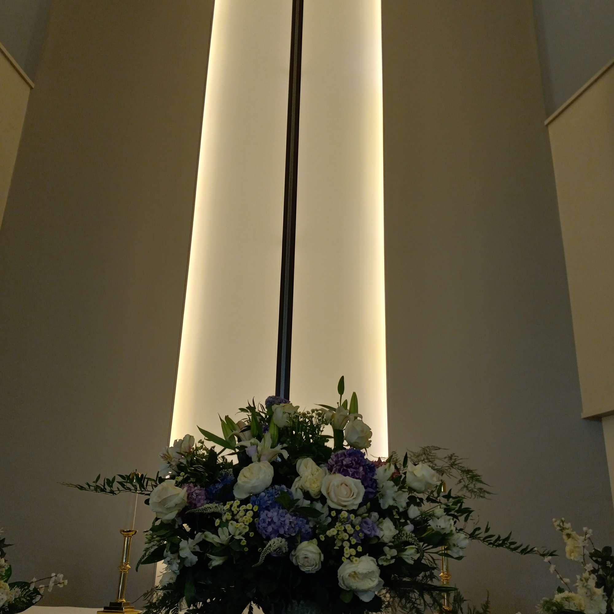 Beautiful purple &amp; white altar vase of white garden roses, lilies, alstroemeria