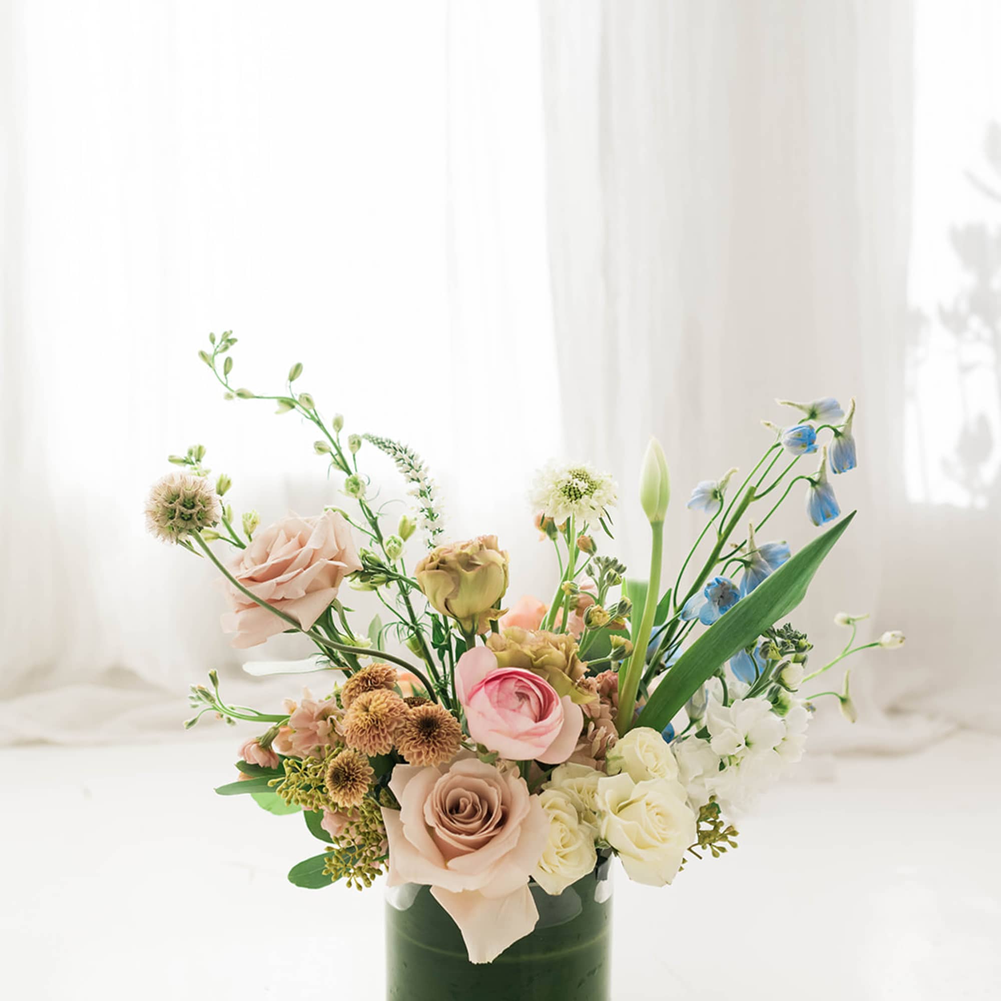 Lovely mix of pastel &amp; earthy premium seasonal blooms. This is a