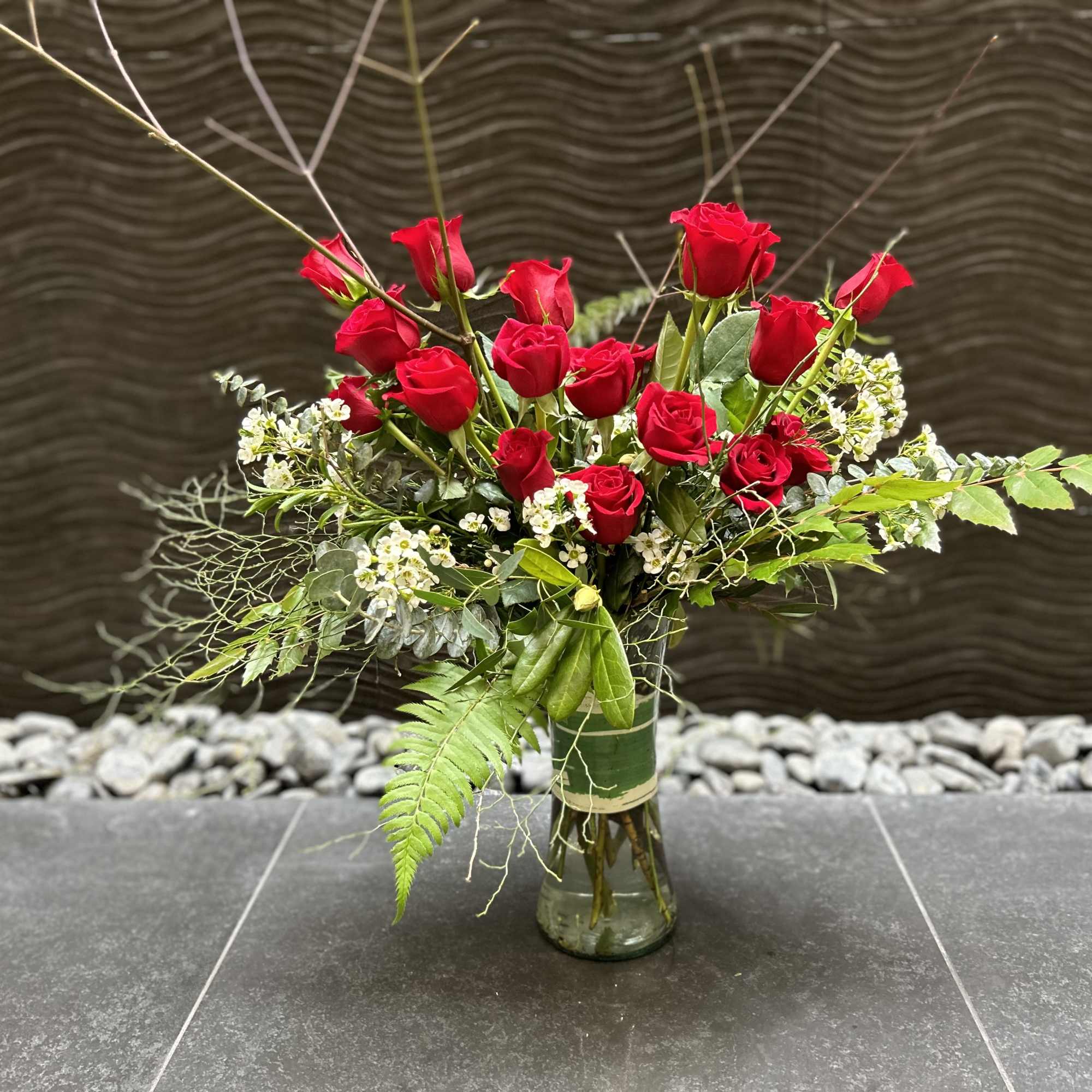 Our take on a traditional design of a dozen long stem Red