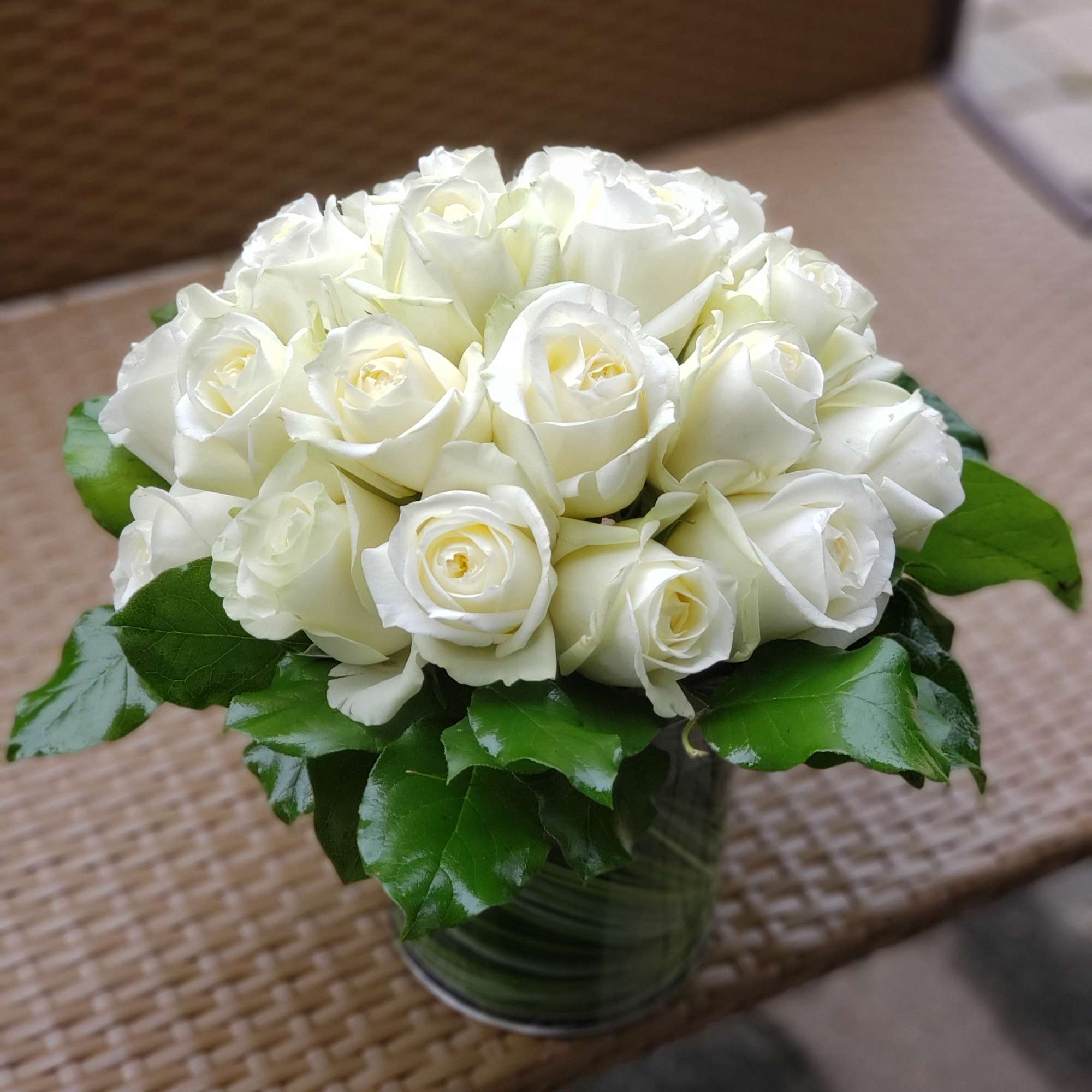 Make a bold statement with this elegantly simple design. White roses symbolize Make a bold statement with this elegantly simple design. White roses symbolize