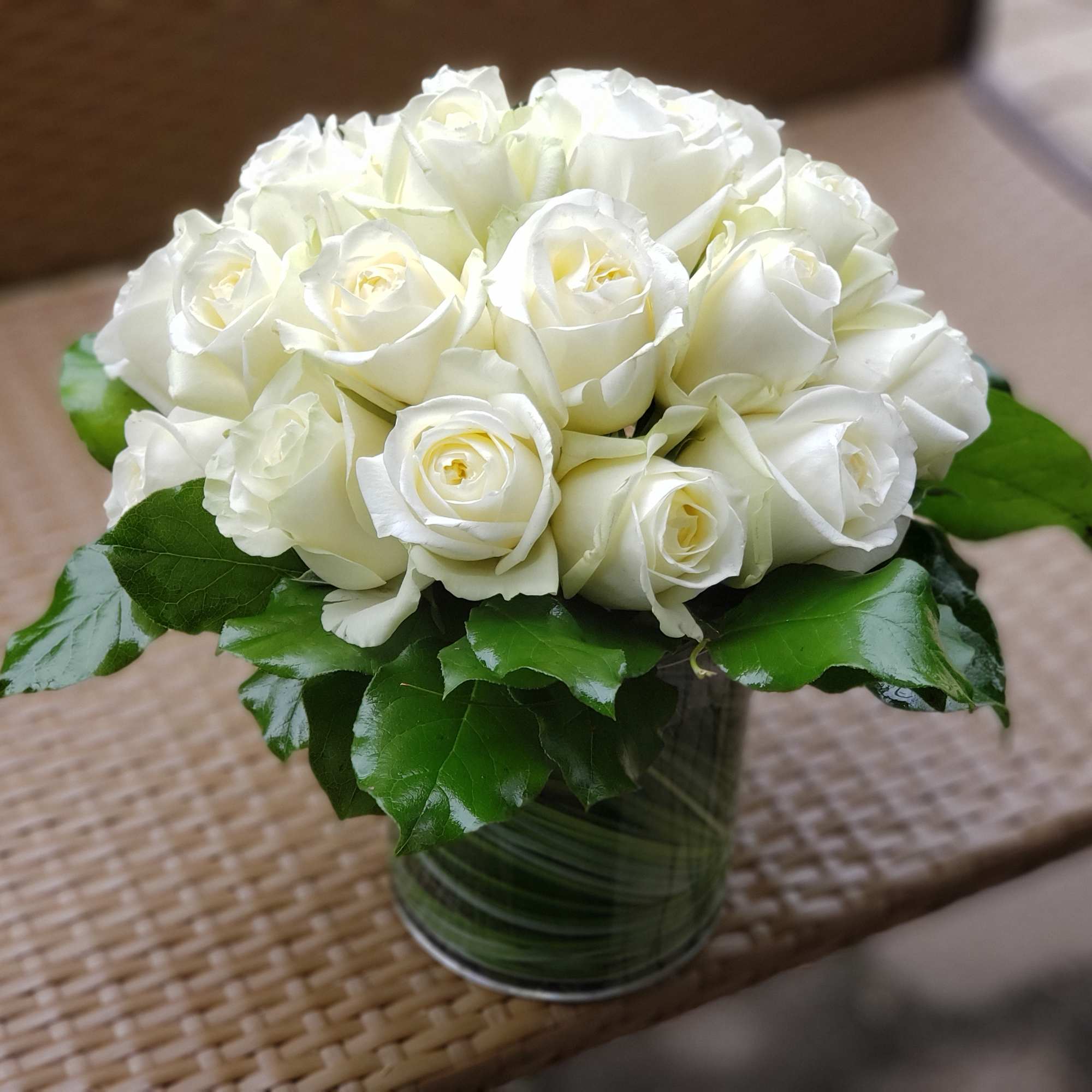 Make a bold statement with this elegantly simple design. White roses symbolize Make a bold statement with this elegantly simple design. White roses symbolize