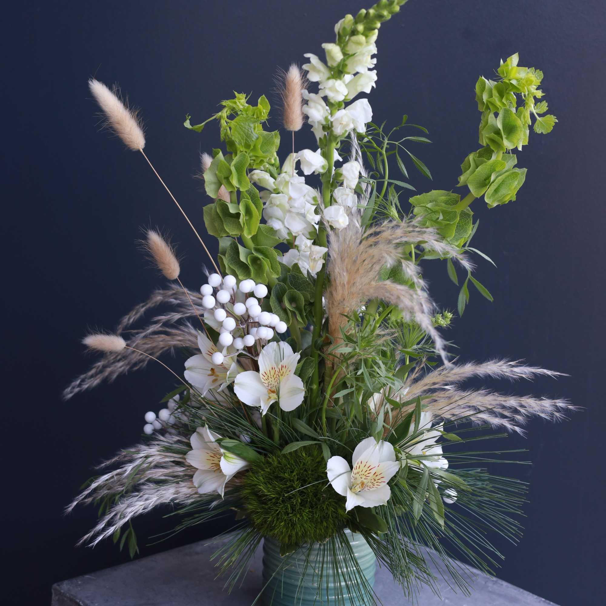 Fresh cut flowers with pompous grass arranged in a trendy boho style